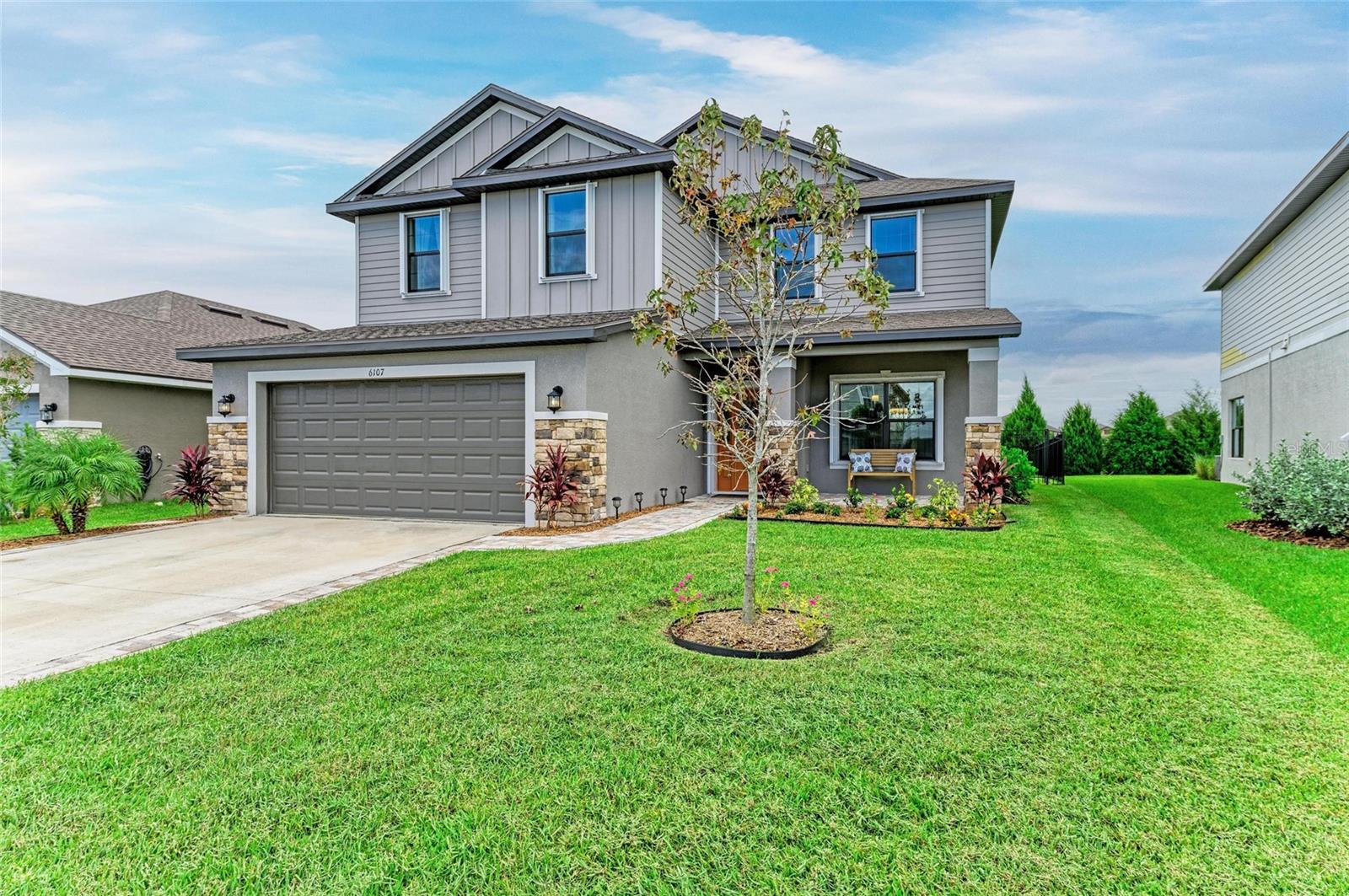 MOVE IN READY AND LIKE NEW with a $10,000 Seller Credit! This home is loaded with nearly $30,000 in recent upgrades, featuring a 5-bedroom, 3.5-bath craftsman-style design in The Aviary at Rutland Ranch. The seller is extending a $10,000 credit at closing, perfect to buy down your interest rate or offset closing costs with an acceptable contract. The thoughtful floor plan features the Primary Suite conveniently located on the main level, while four additional bedrooms and a spacious loft await upstairs—ideal for entertaining or creating a private retreat. The open-concept design on the first floor seamlessly connects the living, dining, kitchen, nook, and powder bathroom, enhanced by plank tile flooring and abundant natural light. The chef’s kitchen offers soft-close custom wood cabinetry with crown molding, granite countertops, and stainless-steel appliances—perfect for food preparation and hosting gatherings. Just off the living room, the expansive primary suite is filled with natural light from multiple windows, and the luxurious primary bath includes a granite double vanity, frameless glass shower door, and a large walk-in closet. Throughout the home, you’ll find designer finishes including volume ceilings, 5 ¼” baseboards, modern five-panel doors, recessed lighting, and custom entry doors. Thoughtful upgrades such as chic drapery, new accordion storm shutters, and a newer washer and dryer add both elegance and peace of mind. The exterior is equally impressive, with charming craftsman-style architecture highlighted by unique stone accents, a welcoming front porch, newer pavers, and fresh landscaping. The backyard offers a generous covered patio, newly installed fencing, and plenty of space for relaxation, play, or entertainment. Residents of Aviary at Rutland Ranch enjoy a wealth of amenities, including a sparkling community pool, playground, cabana, nature trails, and pickleball courts. Ideally located, this home offers a serene suburban lifestyle while remaining close to top-rated schools, shopping, dining, parks, and more. With the seller’s motivation, new accordion storm shutters, and recent improvements, this property presents an exceptional value!