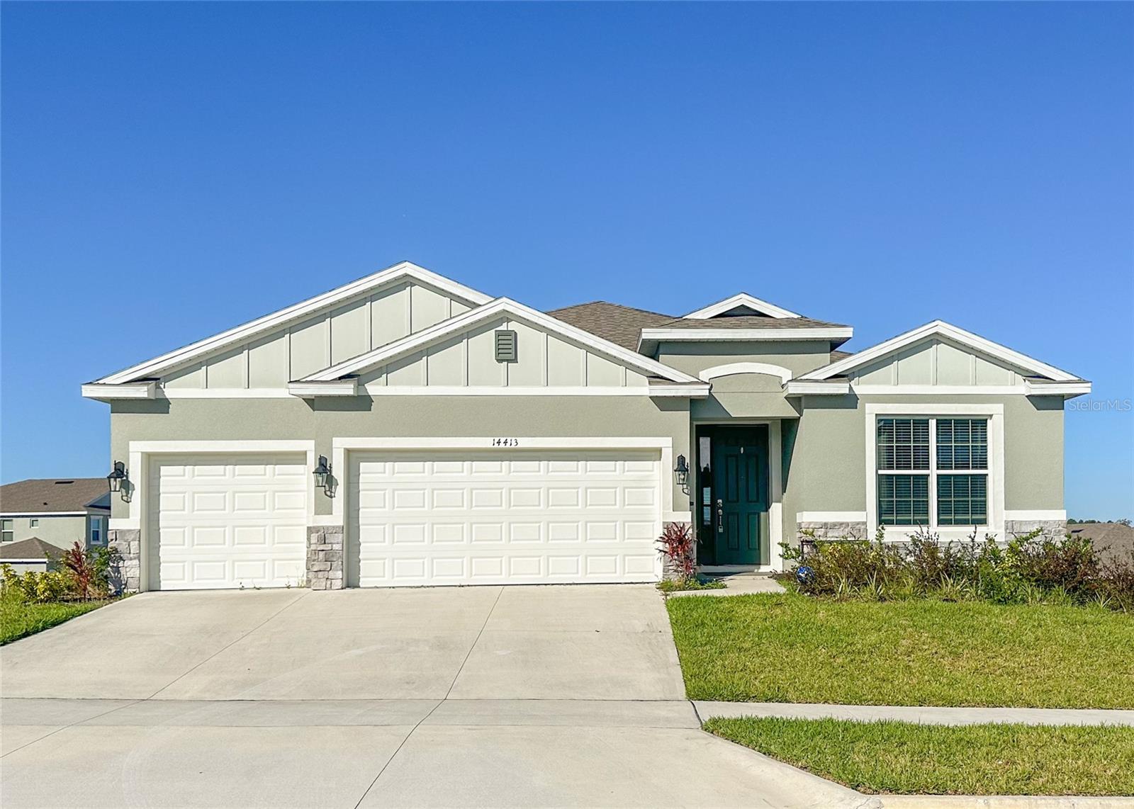 Welcome to 14413 Bayuk Way, a modern four-bedroom, three-bath home located in the new Lake Apopka Sound community. Built by D.R. Horton in 2023 to the Destin model, this 2,376 sq ft property offers spacious living and adaptable accommodation. As you enter the home, you are greeted by abundant natural light, beautiful wood-style tile flooring, and sleek fixtures. To the right, you will find two sizable bedrooms separated by a family bathroom with a shower over the bath. Then, you are welcomed into the open-plan living, kitchen, and dining area, which flows seamlessly and provides excellent entertainment space along with a modern, fully fitted kitchen with a breakfast bar and additional space for a dining table. Off the kitchen, there is a pantry and a laundry room with a washer and dryer included, along with access to the garage. If you prefer a more formal dining area, the living room opens into a spacious dining space with contemporary light fixtures. The primary bedroom, located opposite the main living area, features a beautiful tray ceiling and an arched entrance into an impressive ensuite bathroom, which includes a walk-in closet, a second closet, two vanities, a walk-in shower, a corner bathtub, and a private toilet. There is a fourth bedroom overlooking the rear of the property, accompanied by a family bathroom and a back door leading to the covered lanai. Outside, enjoy a wrap-around yard with views of the community and Lake Apopka to the north, along with a three-car garage and driveway parking. This home is situated in Winter Garden, just past Oakland, with easy access to Florida's Turnpike and State Road 50. It is conveniently close to Historic Downtown Winter Garden, shops, grocery stores, restaurants, and a variety of other excellent amenities.