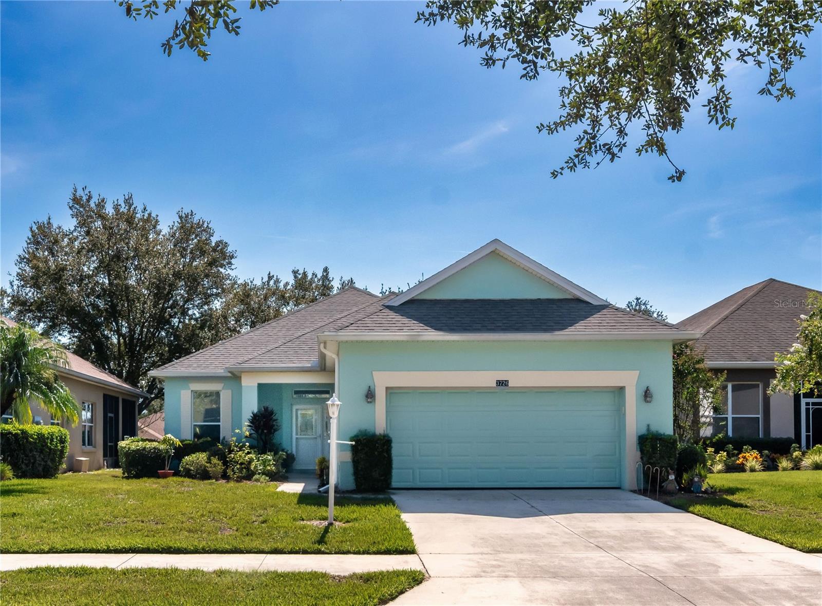 Charming 3BR home in the Plantation at Leesburg, one of Florida’s premier 55+ communities. Recent quality updates include the roof (2023), exterior paint (2021) and water heater (2020). Step inside to a great room that’s open to the kitchen/dining area, with direct access to the lanai, making an overall great gathering space. Kitchen boasts granite counters, attractive tile backsplash and an abundance of counter/cabinet space. Appliances included. Split bedroom plan with primary suite in the back – ideal for privacy. The bedroom features a walk-in closet, lanai access and an ensuite bath w/dual sink vanity, soaker tub and separate shower. Secondary bedrooms tucked off the entry hall near the front. Updated secondary bath features a beautiful frameless shower. Other notable features: an interior laundry room - always a plus, and an extra deep garage – ideal for storage. Out back, you’ll enjoy a screened lanai with tile flooring and ceiling fan. The privacy hedging gives you a quiet spot to enjoy outdoor activities. Lawn care and outside pest control are taken care of by the HOA, giving you easy living! The Plantation at Leesburg is known for its vast array of amenities. There are two guarded gates, two championship golf courses, three staffed activity centers offering numerous activities, clubs, and classes for all sorts of interests to keep you busy, 3 pools (including one Olympic size), fitness centers, ball courts, a restaurant and more! You are less than 15 minutes from the turnpike, providing quick access to all of Central Florida. You’ll love living here. Come see all that makes this home so special.