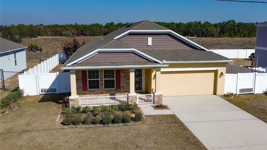 Welcome to this beautifully maintained 3-bedroom, 2-bath home offering approximately 2,000 square feet of living space in the desirable community of Poinciana Village. Built in 2019, this move-in-ready property combines modern construction with thoughtful upgrades throughout. Step inside to find tile flooring throughout the entire home, providing both durability and a clean, cohesive look. The spacious layout offers comfortable living areas perfect for everyday living and entertaining. Enjoy outdoor living at its finest with a large screened-in porch featuring paver flooring, ideal for relaxing or hosting gatherings. The fully fenced front and backyard provide added privacy and security. Additional upgrades include: Whole-house gutter system, Water softening system, Installed camera/security system, Paver enhancements, Fully fenced yard. This property is truly turn-key and ready for its next owner. Schedule your private showing today and experience the comfort and convenience this home has to offer. This community is adjacent to Poinciana Community Park featuring walking path, dog park, playground, basketball courts and much more.