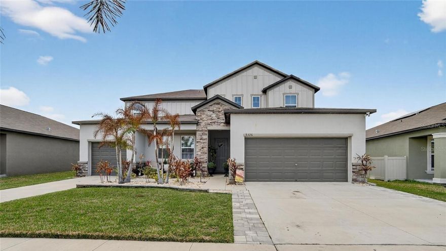 Rare multigenerational gem built in 2022, nestled in the sought-after Belmont subdivision! This stunning property sits on a beautifully landscaped, fully fenced lot with tranquil pond views and a spacious covered, screened lanai — the perfect setting for entertaining and everyday family living.
The main home welcomes you with an open and airy living room that flows seamlessly into a well-appointed kitchen featuring abundant cabinetry, granite countertops, huge center island, a breakfast nook and a separate formal dining room. A convenient powder room completes the first floor, which is finished throughout with elegant tile flooring.
Upstairs, a versatile loft area makes an ideal game room or playroom. The thoughtfully designed three-way split floor plan offers privacy for everyone. The generous primary suite is a true retreat, boasting a huge walk-in closet and a spa-inspired bath with a garden tub, separate shower, and dual vanities. The second bedroom enjoys easy access to a full bath, while bedrooms three through five share the 3rd full bath. A conveniently located second-floor laundry room and beautiful LVP flooring throughout all bedrooms round out this exceptional upper level.

The private in-law apartment is a standout feature, offering a comfortable living room, a full kitchen with ample cabinetry and granite counter tops, a bedroom with a walk-in closet, and a full bath with walk-in shower — ideal for extended family or guests. This apartment comes with its own private entrance and also has access from the main home.
Additional highlights include hurricane shutters, a tankless water heater, and an irrigation system for peace of mind and efficiency.

Residents of Belmont enjoy resort-style amenities including a clubhouse, two oversized pools, a playground, tennis and basketball courts and scenic walking trails.

Ideally located just minutes from shopping, dining, St. Joseph's South Hospital, I-75, and US Hwy 41, with an easy commute to Downtown Tampa, Tampa International Airport, MacDill AFB and the stunning Gulf beaches.

Schedule your private tour today!