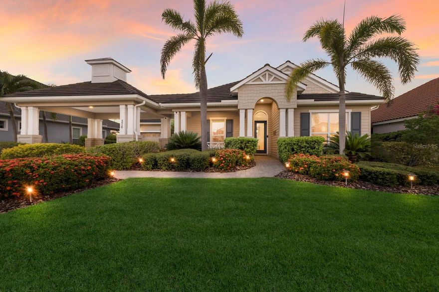 Custom-built coastal elegance meets effortless waterfront living in the coveted gated community, Harbour Walk. Nestled on a wide, deep-water canal with Lock-Free access to Manatee River, this residence offers the best of Florida boating from your private dock - just minutes to sugar-sand beaches, dock-and-dine restaurants & marinas, as well as the Intracoastal, Tampa Bay & the Gulf.  Lush curb appeal sets the tone with classic coastal HardiePlank siding, a paver driveway, and graceful portico parking. Inside, refined craftsmanship shines - 13-foot tray ceilings with crown molding, 8-foot doors, and 22-inch tile laid on the diagonal create an airy, upscale ambiance. Thoughtfully planned, the home offers 3 bedrooms plus an office and 3 bathrooms, including a convenient pool-access bath. Plantation shutters in all bedrooms add clean lines & timeless style. The open-concept heart of the home is made for entertaining: an expansive 10-foot island anchors a chef’s kitchen with granite countertops, gas cooktop, built-in oven, and a walk-in pantry with custom built-ins - all finished with elegant espresso, soft-close cabinetry. Your primary suite is a private retreat with serene views of the pool, canal, and nightly sunsets. The spa-style ensuite features a large shower, separate vanities, a custom walk-in closet, and a chic sitting area with mirrors. Step outside to your personal resort: a heated saltwater pool and spa surrounded by an expansive paver deck for sun-soaked days and golden-hour dinners. On the water, a composite dock stands ready for adventure with a 16,000-lb boat lift, tandem jetski lift, fish-cleaning station, and a floating kayak dock. This is Florida living—elevated. A coastal sanctuary where style, comfort, and the call of the water come together seamlessly. Come fall in love with the home and the lifestyle it offers.