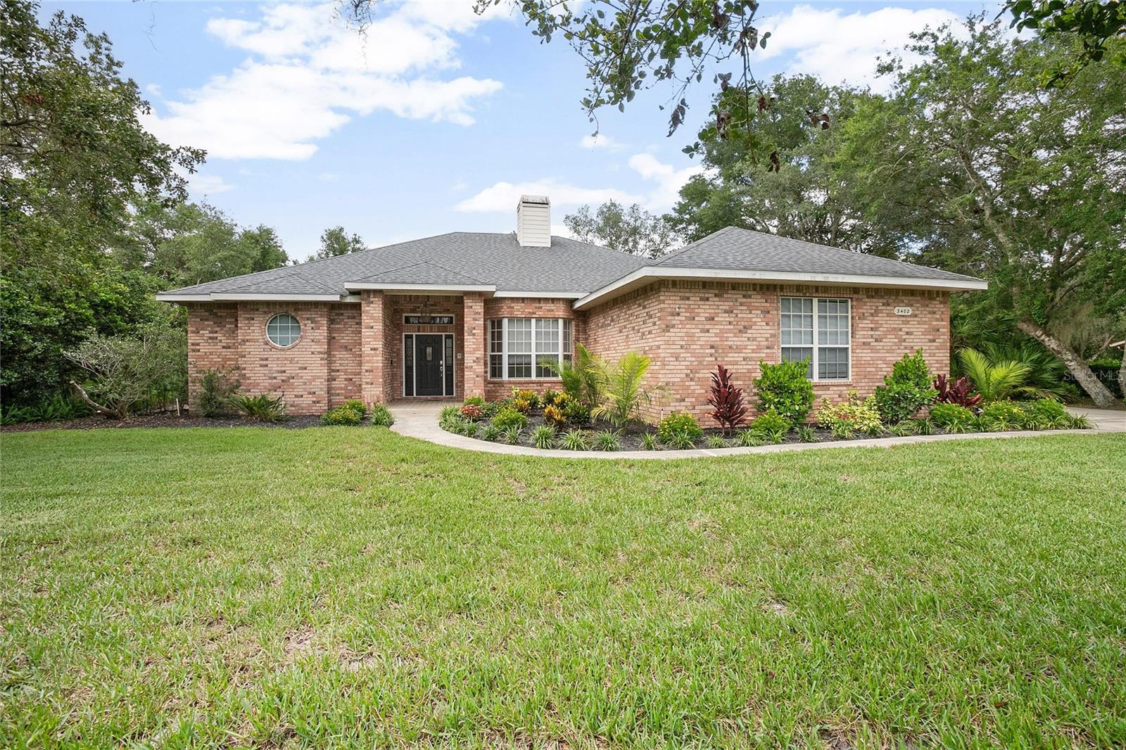 Custom-Built Brick Home in Desirable Trails West – Pool + Guest Suite!
Welcome to Trails West, one of DeLand’s most sought-after neighborhoods, where this custom-built brick beauty by renowned builder Richard Dregger is ready to impress. Situated on a spacious ½-acre homesite, this well-maintained residence offers privacy, comfort, and flexibility for today’s lifestyle. Step inside to find a thoughtful floor plan featuring generously sized living spaces, classic architectural details, and an easy flow to the outdoor oasis. Whether you’re entertaining or enjoying a quiet evening at home, the sparkling pool and covered patio provide the perfect setting. Ideal for multi-generational living or visiting guests, the mother-in-law/guest suite yields its own private space, adding incredible value and versatility. Located in a peaceful, tree-lined community with winding streets and a strong sense of neighborhood pride—this is Florida living at its best, just minutes from charming downtown DeLand, Stetson University, shopping, and dining. Don’t miss this rare opportunity to own a truly special home in Trails West.