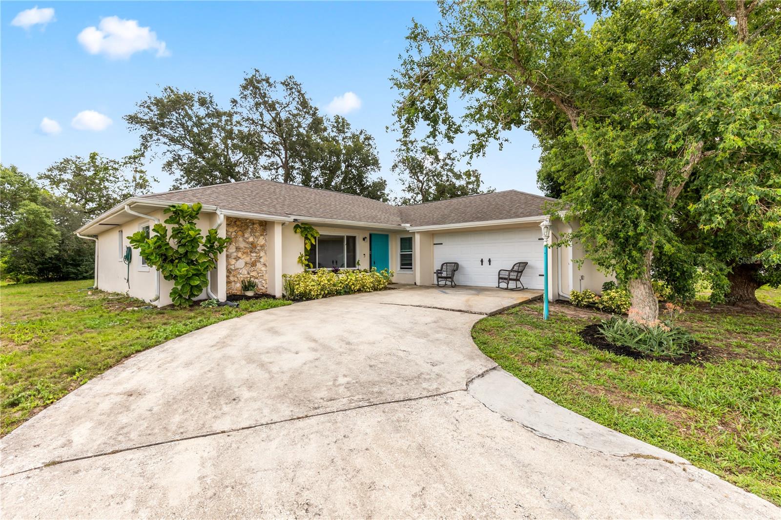 Spacious and inviting, this Deltona home sits on a generous 1/3-acre lot offering plenty of room to relax and entertain with no HOA! Recent updates include a new roof (2021) and water heater (2021) for peace of mind. Step inside to admire the high ceilings in the common area as well as a bonus room in the back featuring built in shelving that is perfect for an office. The home features a split floor plan, newly installed lighting fixtures and an indoor laundry room. The side yard is fenced in and has a cozy fire pit area, ideal for gathering with friends and family. Conveniently located just minutes from I-4 and the Amazon distribution center! Schedule your private showing today!