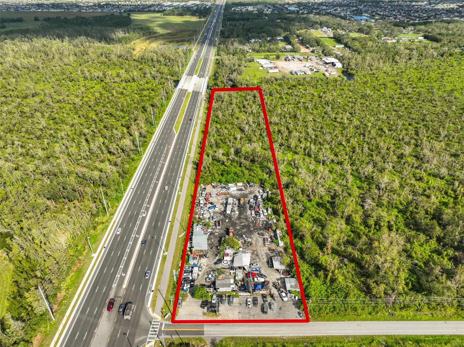 1286 FEET FRONTAGE ON HWY 301!!!! Rare land with HUGE protentional. Currently operates as a family owned Auto Salvage and has been for over 20 years. The land is zoned AS-1 agricultural, but has been grandfathered for Auto Wrecking. However, only your imagination combined with county approved rezoning could make this an amazing opportunity. This lot has 4.5 usable acres on heavily traveled US Hwy. 301 with 1286 feet of frontage on US Hwy. 301 and 197 feet of frontage on Bill Tucker Road. The possibilities for use are endless!