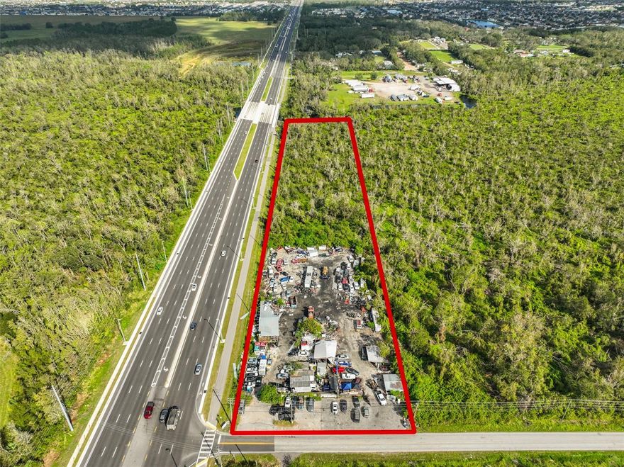 1286 FEET FRONTAGE ON HWY 301!!!! Rare land with HUGE protentional. Currently operates as a family owned Auto Salvage and has been for over 20 years. The land is zoned AS-1 agricultural, but has been grandfathered for Auto Wrecking. However, only your imagination combined with county approved rezoning could make this an amazing opportunity. This lot has 4.5 usable acres on heavily traveled US Hwy. 301 with 1286 feet of frontage on US Hwy. 301 and 197 feet of frontage on Bill Tucker Road. The possibilities for use are endless!