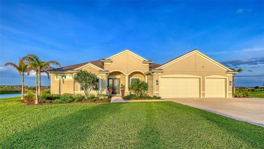 An exceptional estate tucked away in the peaceful Hampton Lakes community of Sarasota is waiting for its new owner!  Situated on a breathtaking 3-acre homesite with a beautiful pond setting, this property offers the perfect balance of privacy, space, and modern convenience—just minutes from Waterside Place and the vibrant amenities of Lakewood Ranch. Enjoy daily encounters with Florida’s natural wildlife, creating a serene and ever-changing backdrop right in your own backyard.

From the moment you arrive, the stately presence of the home with hurricane impact windows and doors and 3-car garage set the tone for what’s inside. Step through the double front doors into a light-filled foyer, where beautiful luxury vinyl flooring flows throughout the thoughtfully designed open floor plan. To the right, a sophisticated dining room showcases a tray ceiling, grasscloth wallpaper, and custom lighting—perfect for hosting elegant dinners. To the left, a private office with double doors offers a quiet workspace with serene front yard views.

At the heart of the home, the gourmet kitchen is both stylish and functional, featuring light cabinetry, quartz countertops, a subway tile backsplash, double ovens, an induction cooktop, and an area that serves as a breakfast bar in the beautiful kitchen. Nearby, a spacious laundry room with an oversized mudroom and additional storage adds everyday convenience.

Designed for seamless indoor-outdoor living, the main living areas are filled with natural light and open effortlessly to the lanai through sliding glass doors. Enjoy tranquil water views from nearly every angle, including the inviting living room with an aquarium window. The expansive bonus room at the rear of the home offers endless possibilities, complete with high ceilings and pocketing sliders that fully open to the outdoor living space—ideal for entertaining or relaxing.

Step outside to your private retreat, where the pool/spa and lanai overlook the picturesque pond and surrounding nature, offering a peaceful setting for gatherings or quiet evenings at home. The outdoor kitchen was newly installed in 2025 with a new TV (2025) to enjoy while being in the Spa!

The luxurious primary suite is a true escape, featuring a tray ceiling, custom closets, and a spa-inspired bathroom with quartz countertops, dual vanities, and generous storage. Three additional bedrooms provide comfort and privacy for family and guests alike.

This is more than a home—it’s a lifestyle. Experience the perfect blend of space, elegance, and tranquility at 3554 Recurve Circle.