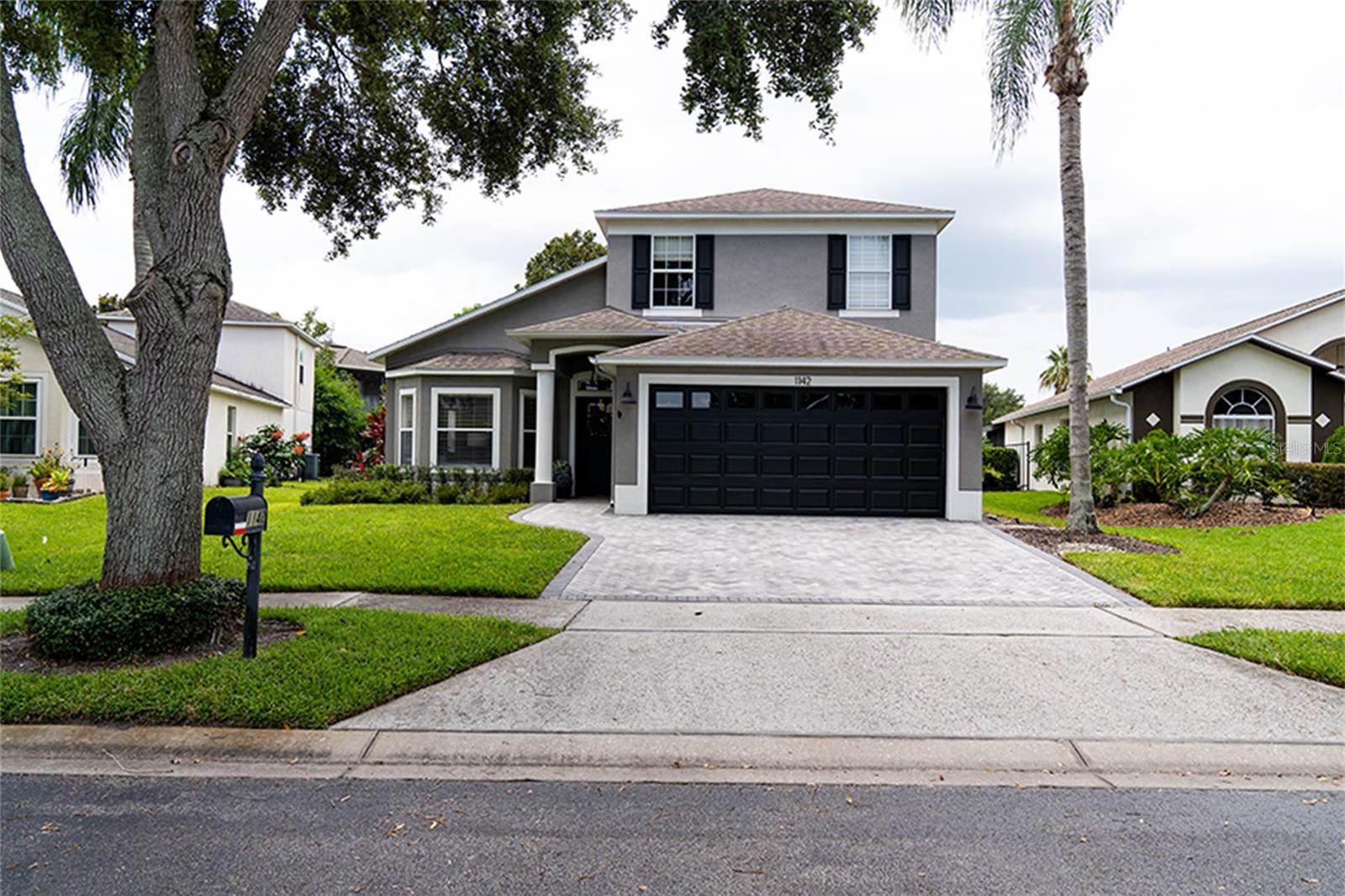 Welcome to Stoneybrook West! This meticulously maintained 4-bedroom, 2.5-bathroom home offers a perfect blend of modern upgrades and everyday functionality. From the moment you arrive, you’ll notice the impressive curb appeal featuring new sod, professional landscaping, a widened paver driveway (2024), a freshly painted garage door, and updated epoxy garage floors with new interior paint. A modern front entry door sets the tone for the thoughtfully updated interior.
Inside, the home has been freshly painted throughout and features new hardwood flooring on the first level, custom shaker-style decorative wall paneling, and a fully updated staircase with new railings and a custom stair runner. New blinds have been added to all first-floor windows, enhancing natural light and privacy.
The kitchen has been completely remodeled with marble countertops, a subway tile backsplash, a farmhouse sink, a custom shiplap hood, and all-new modern hardware and faucet. A built-in shaker-style banquette bench in the breakfast nook adds charm and functionality. Throughout the home, all interior doors have been replaced with shaker-style doors featuring updated modern hardware, including the pantry door. The guest half bath has also been fully remodeled with a fresh, clean design.
Located in one of Winter Garden’s most sought-after gated communities, this move-in-ready home offers resort-style amenities, top-rated schools, and easy access to shopping, dining, and major roadways.