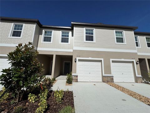 Photo of 10149 Trumpet Honeysuckle Way, Wesley Chapel, FL 33545 (MLS # O6350158)