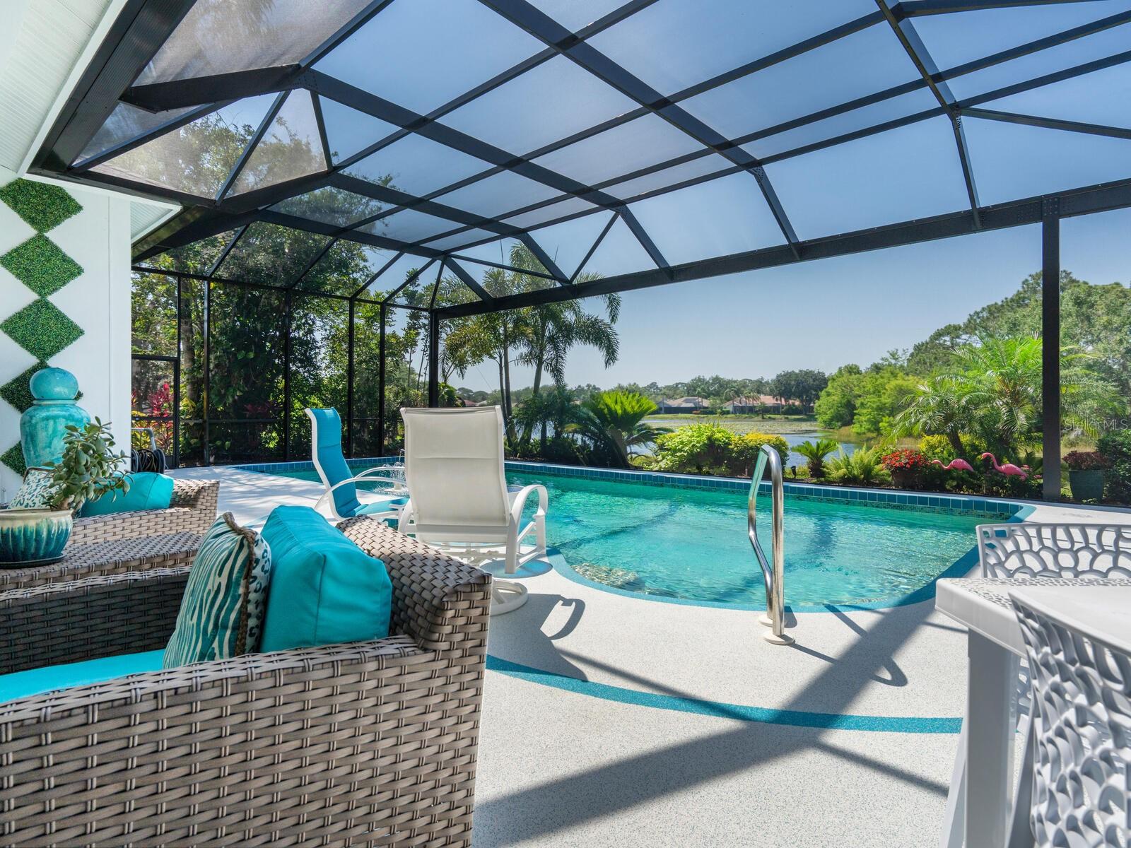 Reminiscent of On Golden Pond, this waterfront sanctuary will immediately capture your attention and permeate the senses. With 3 bedrooms and 4 baths, the visual presentation is extraordinary and perfectly defines a lifestyle of gracious sophistication and timeless appeal. Located in Palmer Ranch’s Deer Creek community and within 5 miles of area beaches, this Arthur Rutenberg showpiece could be featured among the pages of any prominent magazine. On one living level, every room of this custom 3,024 square foot residence has been thoughtfully stylized, blending casual comfort with romantic elegance.
Drop-dead gorgeous interiors are adorned with incredible fixtures and finishes second to none, and the free-flowing layout is displayed like fine art. Stunning White Patagonia granite throughout and floor-to-ceiling Italian marble add a touch of extravagance to all 4 baths, the family room, primary suite, and office. A sense of spaciousness is amplified by 12-foot ceilings, and Pella windows allow ambient light to wrap the space in a warm, inviting embrace.
The home’s uniquely defined spirit of prestige and luxury is second only to the amazing lakefront setting, anchored by a 42-foot pool—the largest in the neighborhood—featuring a dolphin mosaic, a waterfall, and Hayward therapy spa jets. This outdoor oasis is complemented by a covered open-air lounge, perfect for entertaining or quiet moments of retreat. Undeniably one of a kind, the panoramic views bring an ambiance of renewal with each day. As dusk approaches, the terrace becomes center stage, where a symphony of scarlet, amber, and gold drape across the evening sky and reflect in the water below.
An invitation lingers in the air and beckons you to take in nature’s abundant habitat and lush surroundings, while enjoying simple moments of reflection or dining alfresco under the stars. With a backdrop of magnificent lake views, the great room was generously designed for lavish get-togethers, and a white grand piano serves as a dynamic focal point to the room’s tasteful décor. Massive designer-inspired atrium windows illuminate a carefully crafted kitchen with top-tier amenities for a heightened culinary experience. The adjoining dining and family rooms offer expansive lake views through window walls opening wide to the outdoor setting.
A poolside primary suite is a world of its own, where separate his-and-her bath ensembles and a spacious wardrobe closet offer spa-like indulgence. It's only one block from the Legacy Trail, which stretches from Venice to downtown Sarasota, offering miles of scenic biking, rollerblading, and running. You'll also enjoy close proximity to golf courses, shopping, and other everyday conveniences.
Additional honorable mentions include a 3-car garage, office with fireplace, nearly-invisible Clear View pool screening (2025), non-slip poly (2023) pebble tech pool decking, a columned and double-door entrance, interior transom windows, intricately tiled niches, bejeweled lighting, built-ins with glass-beaded shelving, professionally landscaped gardens, enriched curb appeal, and many other exquisite details.
With a particular interest in light, materials, and movement, the remarkable architectural vision of making this home a more meaningful place is a dream come true for those who live within. A truly special residence — and one that will not soon be forgotten. Furnishings available with a few exceptions.