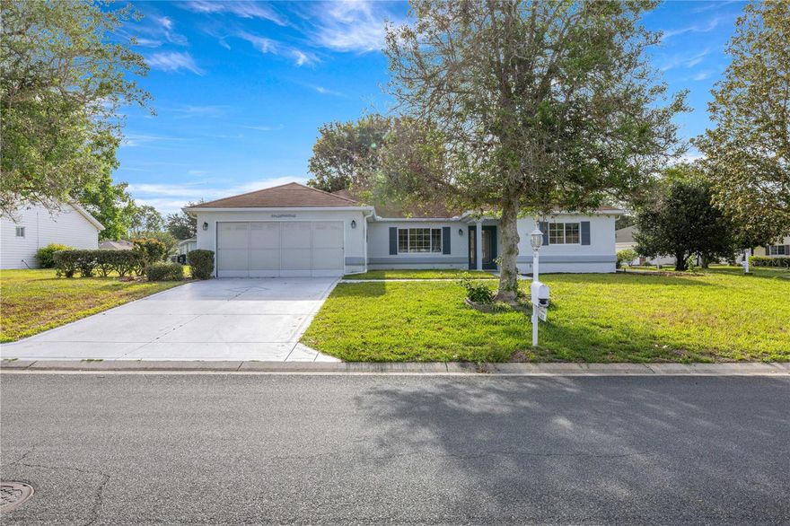 Welcome to this beautifully updated home located in the highly desirable Spruce Creek Golf & Country Club – Candlestone community. Situated on a premium corner lot, this property offers added privacy, curb appeal, and freshly mulched landscaping in one of Summerfield’s most sought-after 55+ gated communities. This popular Holly Expanded floor plan features a functional split layout with 3 bedrooms and 2 bathrooms, providing flexibility for guests, a home office, or hobby space. Enjoy low-maintenance living with no carpet throughout, vaulted ceilings complemented by fresh interior paint and updated cabinetry that give the home a clean and modern feel. The screened-in lanai, completed in 2021, offers the perfect space for relaxing or entertaining while overlooking the spacious yard. Additional updates include a newer AC system installed in 2023, providing comfort and peace of mind. The home also features great curb appeal with a designer-style driveway and walkway. Residents of Spruce Creek Golf & Country Club enjoy resort-style amenities including multiple pools and spas, golf courses, clubhouse, fitness center, tennis, pickleball, bocce ball, shuffleboard, and a wide variety of clubs and social activities. Additional community features include walking paths, a gazebo, and on-site dining options. No bonds or CDD fees and conveniently located near shopping, dining, and medical facilities. Don’t miss your opportunity to enjoy an active lifestyle in this vibrant community.