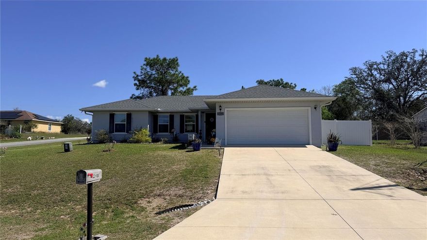 WHAT A GREAT NICELY KEPT HOME WITH VINYL PRIVACY FENCED BACK YARD! THIS ARMSTRONG LILLY MODEL BUILT IN 2021 IS CONVENIENT TO LAKE WEIR, OCALA AND THE VILLAGES AS WELL AS BELLEVIEW. OPEN FLOOR PLAN GREETS YOU KEEPING EVERYONE ENGAGED…PERFECT FOR ENTERTAINING. GLASS SLIDERS IN THE DINING AREA OVERLOOK THE FENCED YARD WITH STORAGE BUILDING. KITCHEN HAS MASSIVE COUNTER PERFECT FOR WORK SPACE PLUS LARGE CLOSET PANTRY FOR ALL YOUR FOODSTUFFS. AND DON’T FORGET THE BAY WINDOW THAT DRENCHES THE KITCHEN WITH NATURAL LIGHT! SPLIT BEDROOM PLAN PROVIDES PRIVACY WITH BDRM 2 & 3 SHARING A BATH WITH SHOWER/TUB COMBO. PRIMARY BEDROOM INCLUDES EN-SUITE BATHROOM WITH STEP IN SHOWER. BEDROOM IS SPACIOUS WITH GOOD NATURAL LIGHT AND WALK IN CLOSET. DURABLE LUXURY PLANK VINYL MAKES CLEAN UP A BREEZE…JUST SWEEP, DAMP MOP AND GO. IDEAL FOR PETS OR ALLERGIES TOO! 2 CAR GARAGE AND INSIDE LAUNDRY ROUND OUT THIS CHARMING AFFORDABLE HOME!