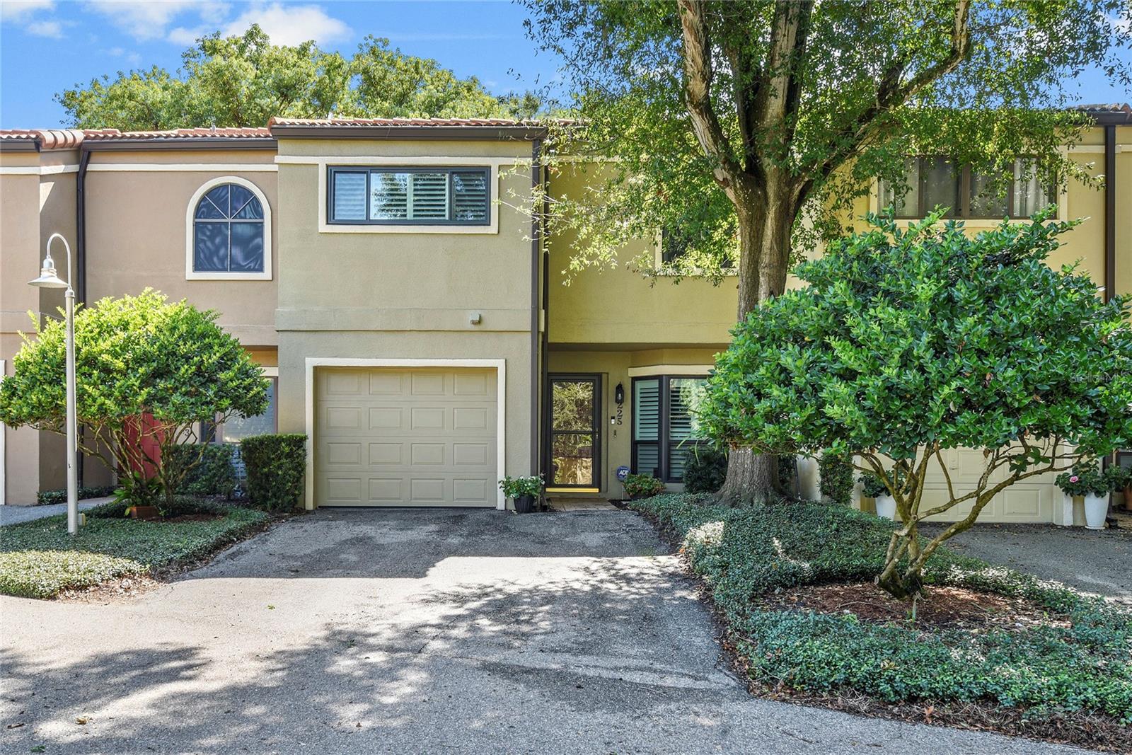 Discover the perfect blend of style and location in this beautifully updated 3-bedroom, 2.5-bathroom townhome in the sought-after Moorings community. With 1,652 square feet of thoughtfully designed living space, this residence offers a bright, open floor plan enhanced by vaulted ceilings and an abundance of natural light.
The heart of the home is the stunning kitchen, showcasing white cabinetry, quartz countertops, stainless steel appliances, a decorative hood above the cooktop, and a classic subway tile backsplash. A charming bay window creates the perfect breakfast nook, while the open-concept living and dining areas provide ideal space for entertaining and everyday living. A wood-burning fireplace adds warmth and ambiance to the living room, creating a cozy focal point.
Step through French doors into a sun-drenched sunroom with walls of windows overlooking tranquil community green space – your own private retreat for morning coffee or evening relaxation. Luxury vinyl plank flooring flows throughout the main level, complemented by plantation shutters and fresh paint.
The second floor houses all three generously sized bedrooms, including a serene primary suite with a completely renovated en suite bathroom featuring a double sink vanity, walk-in shower, and spacious walk-in closet with custom built-ins. The updated hall bath offers a tub/shower combo and single-sink vanity. The second bedroom also features custom built-in closet organizers for added storage and convenience. Additional features include ceiling fans, interior laundry, and an attached one-car garage.
Living in The Moorings means enjoying exclusive amenities, including a community dock on Lake Maitland, sparkling pool, and clubhouse. The location is unbeatable – just moments from Maitland's charming Lake Lily Park and its popular weekly farmer's market, five minutes from the upscale shops and dining of Park Avenue, and surrounded by the best of Central Florida's shopping, restaurants, and entertainment.