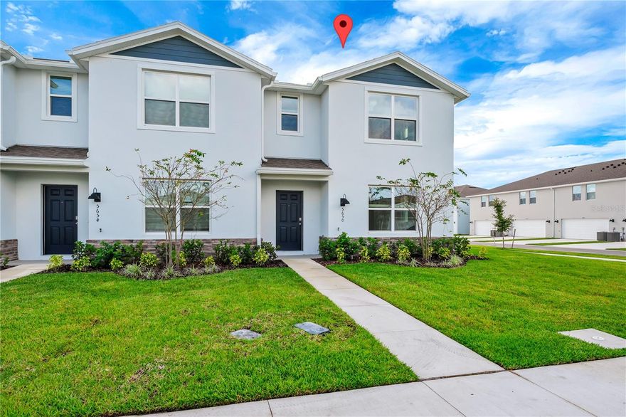 Discover the exceptional appeal of this brand-new, never-been-lived-in townhome, completed in 2025 at 5650 Anders Way in Saint Cloud, FL. Offering 3 bedrooms and 2 bathrooms, this modern residence provides a premium, low-maintenance lifestyle.
The interior showcases an open-concept living area with modern gray tile flooring on the main level. The contemporary kitchen features white cabinetry, granite countertops, a center island, and a full suite of stainless steel appliances. Upstairs, bedrooms are finished with comfortable carpeting, and the primary suite includes a generous walk-in closet. The property features a clean, neutral palette throughout and an attached two-car garage.
Residents enjoy access to fantastic community amenities, including a resort-style swimming pool and sun deck. Situated conveniently off Narcoossee Road, the location is a commuter's dream, providing quick access to major Central Florida highways like SR 417 (Central Florida GreeneWay) and the Florida Turnpike. This positioning places the home just minutes from the Lake Nona Medical City and the Orlando International Airport (MCO). World-famous attractions, including Walt Disney World and Universal Studios, are a short drive away, perfectly blending peaceful, new construction living with Central Florida convenience.
