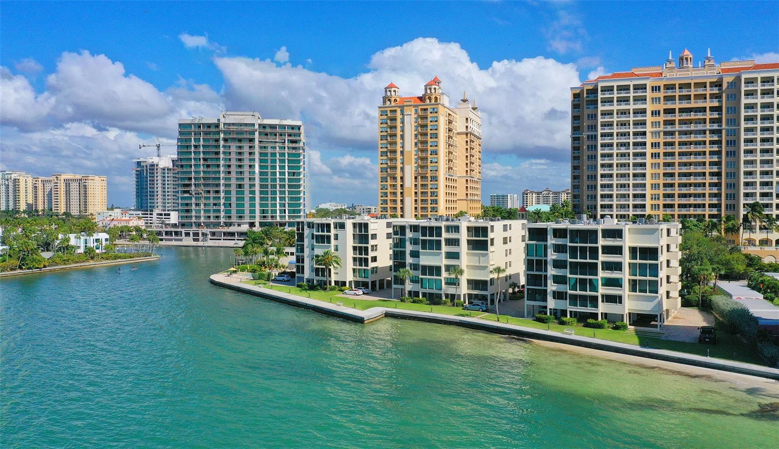 UNPARALLELED BAYFRONT LIVING… with full, unobstructed views of Sarasota Bay awaits in this exquisitely updated residence at Lawrence Pointe. Situated in one of Sarasota’s most sought-after boutique communities, this renovated condo features a modified floor plan that enclosed the terrace, adding nearly 200 SQFT of additional interior living space. Chic designer upgrades include Italian porcelain tile flooring throughout, crown molding, and LED recessed lighting. Added peace of mind with IMPACT WINDOWS & SLIDERS, plus roll down STORM SHUTTERS, new A/C (2025) and new roof (2025). Open kitchen designed to impress with custom cabinetry, quartz countertops, stone backsplash, Viking professional-grade stainless steel appliances, and a breakfast bar. A dedicated dining area blends with the living area and kitchen. Enjoy breathtaking water views from every room. The spacious primary suite includes a spa-inspired bath with a large vanity, dual sinks, quartz countertops, porcelain and glass walk-in shower, and a custom walk-in closet. The guest suite features its own walk-in closet and an elegantly updated bathroom with porcelain and glass shower. Convenient interior laundry closet with stack-able Frigidaire washer and dryer. Designed by renowned Sarasota architect Tim Seibert, Lawrence Pointe is a gated, pet-friendly community with only 40 residences spread across three low-rise buildings. Amenities include a bayfront pool, clubhouse, secured lobby, elevator access, on-site storage, and on-site management, along with assigned covered parking. Nestled on a private cul-de-sac shared with the Ritz-Carlton, this incredible location is just a short walk to downtown Sarasota, the Bayfront, theaters, museums, boutique shopping, and award-winning dining. Only a bike ride away from Gulf beaches. Your urban oasis awaits. Where every day ends with unforgettable sunsets and sweeping view of Sarasota Bay.