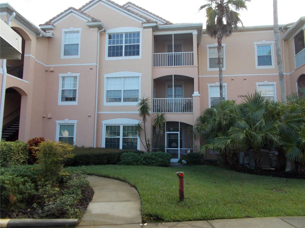 Photo of 13548 Turtle Marsh Loop #420, Orlando, FL 32837 (MLS # O6428460)