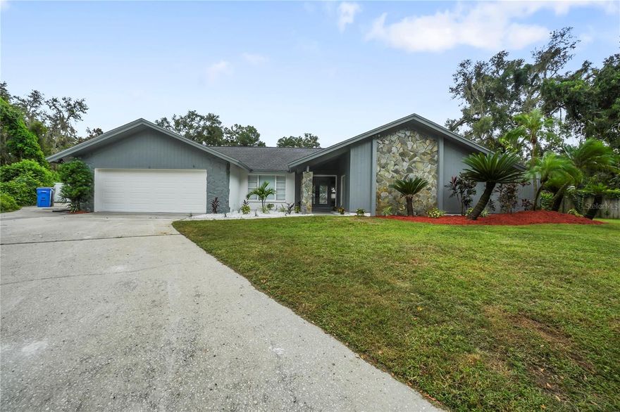 Nestled in Valrico, FL, this remodeled 4-bedroom, 3-bathroom home sits on a generous 0.45-acre lot, offering a premier combination of modern upgrades and spacious living. From the moment you enter, you’ll be drawn to the inviting view of the pool through the sliding glass doors in the formal living and dining areas. The kitchen and family room flow together in an open-concept layout, ideal for entertaining, with a gourmet kitchen featuring quartz countertops that flow seamlessly into the backsplash, stainless steel appliances, an oversized island, and abundant cabinet space. The family room stands out with cathedral ceilings, wood beams, and a cozy fireplace, creating a warm centerpiece for gatherings. The master suite includes sliders to the pool, his-and-her sinks, and a large walk-in shower, while the remaining bedrooms comprise three guest rooms and two additional bathrooms, providing ample space for family and guests. A convenient laundry room and a 2-car garage add everyday ease and storage. The outdoor oasis begins with a screened-in pool and extends to a large, fully fenced backyard, offering privacy and plenty of room for outdoor activities and future upgrades. Valrico’s friendly, community-focused lifestyle places local schools, shopping, dining, and parks within easy reach, making this home a perfect blend of modern elegance and family-friendly comfort.