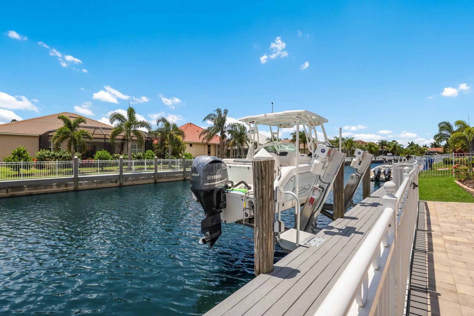WHOLE HOUSE GENERATOR, IMPACT WINDOWS & SHUTTERS, NEW POOL SCREENING! Discover the ultimate in coastal elegance at Harbour Walk at the Inlets—an exclusive, gated community where luxury meets laid-back waterfront living. This stunning 4-bedroom, 3-bath home (plus a versatile bonus room) sits proudly on a peaceful canal with direct access to the Gulf and beyond—your gateway to endless boating adventures. Designed for both comfort and style, the home features a whole-house generator, a roomy 3-car garage, and a private dock equipped with a built-in elevator boat lift—perfect for stress-free days on the water. Inside, soaring ceilings and serene views create a light, airy vibe, while the chef’s kitchen stuns with quartz countertops, natural gas, stainless steel appliances, and tons of storage. Seamless indoor-outdoor living is at the heart of this home. Host unforgettable gatherings in the expansive screened lanai with a full outdoor kitchen, or simply unwind by your private pool and spa after a day on the water. The luxurious owner’s suite is your personal retreat, complete with a spa-inspired bath, dual vanities, a large shower, and a relaxing garden tub. Beyond the home, Harbour Walk offers top-tier amenities: 24-hour guard gate, tennis courts, playground, walking trails, an observation pier, and even a kayak launch. Plus, with no CDD fees, you're enjoying all the perks without the extra cost. Whether you're cruising to the Manatee River or Sarasota Bay, or heading to nearby beaches, airports, or the high-end UTC shopping district—everything is just a short trip away. This is more than a home—it’s a lifestyle. A rare opportunity to embrace waterfront living at its finest.