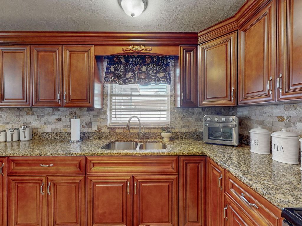 Photo of 5763 55th Terrace N, Kenneth City, FL 33709 (MLS # TB8493596)