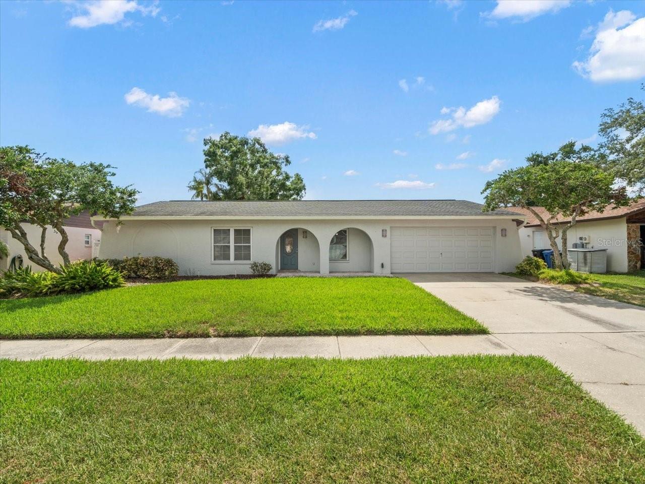Experience refined Florida living in this updated 4-bedroom, 2-bath pool home, tucked within a serene and well-established neighborhood. The interior showcases natural light through the quiet double-paned windows. The living & dining spaces, designer-updated bathrooms, and a gourmet kitchen featuring custom cabinetry, premium stainless steel appliances, and a butler’s pantry create the perfect place to entertain. The inviting family room opens through French doors to a covered patio and sparkling pool—perfect for seamless indoor-outdoor entertaining. The private primary suite offers recessed lighting, a generous wall-to-wall closet, and a sleek en-suite bath with modern finishes. Thoughtfully designed with a split-bedroom layout, three spacious guest rooms share a beautifully appointed bathroom—ideal for both family living and hosting guests in comfort.
Step outside into your own private oasis. The covered patio overlooks a sparkling open pool, creating an idyllic backdrop for barbecues, morning swims, or evening relaxation. The fenced backyard offers plenty of space for outdoor opportunities and a storage shed provides additional outdoor storage.
Ideally located just minutes from parks, top-rated schools, and upscale shopping and dining, this move-in ready retreat is the perfect blend of elegance, comfort, and convenience.Don’t miss this move-in-ready gem with all the right upgrades. Schedule your showing today!