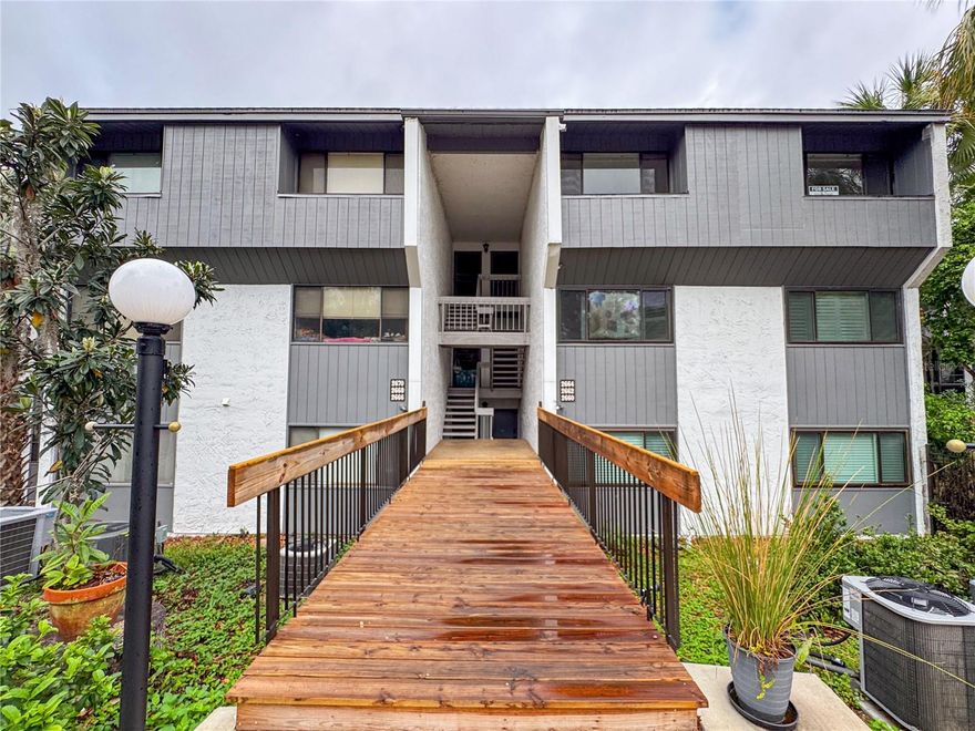 This TURN KEY, fully upgraded TOP FLOOR two bedroom and one bathroom condo in Bivens Lake Estates South offers a beautifully renovated kitchen with real wood cabinetry, solid surface countertops, and a large breakfast bar that opens to an expansive living and dining area with space for a huge sectional and a large formal dining table. Luxury vinyl plank flooring runs through the common areas, complemented by new Berber carpeting in the spacious primary suite. The bathroom has been completely remodeled with wood-look ceramic tile, a new vanity with quartz countertops, and a stunning fully tiled walk-in shower with a glass sliding door. The AC unit was replaced in 2024. A huge enclosed lanai of more than 300 square feet overlooks Bivens Arm through mature Florida oaks, creating a peaceful retreat. On a beautiful day you can head to the community dock or launch a kayak, paddleboard, or canoe to explore the gorgeous 189 acre lake right in your backyard. These are among the only waterfront condos in Gainesville and are conveniently located just one mile south of UF Health Shands Hospital and the University of Florida. Schedule your tour of this exceptional opportunity today.