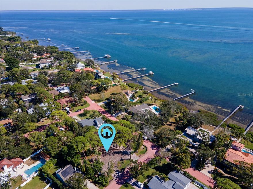 A once in a generation opportunity is NOW to create the home of your dreams in the iconic and picturesque Pink Streets of St. Petersburg. For the first time in over 30 years, one of the largest land parcels in this tranquil and coveted neighborhood is being offered for consideration. Situated at the southernmost tip of Pinellas County, and just across the street from the sparkling open waters of Tampa Bay, this estate-sized corner lot spans almost 1/2 acre, and is framed by the historic coral-pink winding streets and impressive and lush tree canopies that define the community. The lot encompasses over 19,105 square feet of land, which is truly rare-to-find in St. Petersburg. The expansive size of the parcel (156’ x 120’) presents a unique opportunity for discerning builders, architects and future owners to design and create a residence of unparalleled creativity and grandeur, perfectly placed in this elegant and peaceful setting. The lot’s generous size provides flexibility for thoughtful design in scale and style in this neighborhood known for it’s distinctive aesthetic and charm. The Pink Streets community was developed in the early 1900s, and is celebrated for its rich history and iconic winding concrete pastel-pink streets, dotted with magnificent homes of varied architectural styles. It is truly a hidden gem. The lifestyle here is serene and elegant, with easy walkability to waterfront views and parks overlooking the Skyway Bridge, including Katherine B. Tippetts Park, the Tocobaga Indian Mounds and Bay Vista Park with boat ramp, playground and recreation facilities. The location is superb, offering easy access to both Tampa and Sarasota and multiple airports, and just a few minutes drive to bustling downtown St. Petersburg, and our gorgeous award-winning Gulf Coast beaches. A Buildable Lot Letter has been secured from the City of St. Petersburg. The lot is located in the NS-2 zoning district, and the property in its current configuration qualifies for a new build of a single family estate plus an accessory dwelling unit. Variances to adjust the current lot to accommodate for additional structures or individual homes may be pursued with the City by the future developer or owner. Buyers to verify all building and permitting details directly with the City of St. Petersburg. Listing agent and brokerage make no guarantees regarding future development approvals or variance outcomes. Don’t miss this truly rare opportunity to build in one of St. Petersburg’s most treasured neighborhoods.