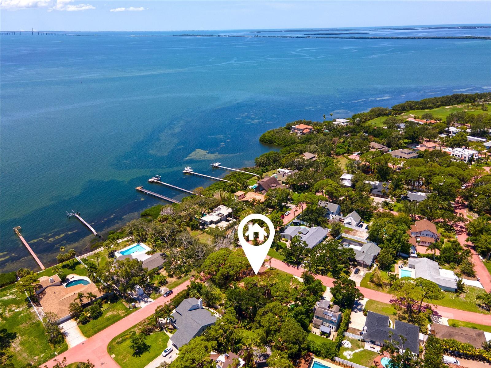 A once in a generation opportunity is NOW to create the home of your dreams in the iconic and picturesque Pink Streets of St. Petersburg. For the first time in over 30 years, one of the largest land parcels in this tranquil and coveted neighborhood is being offered for consideration. Situated at the southernmost tip of Pinellas County, and just across the street from the sparkling open waters of Tampa Bay, this estate-sized corner lot spans almost 1/2 acre, and is framed by the historic coral-pink winding streets and impressive and lush tree canopies that define the community. The lot encompasses over 19,105 square feet of land, which is truly rare-to-find in St. Petersburg. The expansive size of the parcel (156’ x 120’) presents a unique opportunity for discerning builders, architects and future owners to design and create a residence of unparalleled creativity and grandeur, perfectly placed in this elegant and peaceful setting. The lot’s generous size provides flexibility for thoughtful design in scale and style in this neighborhood known for it’s distinctive aesthetic and charm. The Pink Streets community was developed in the early 1900s, and is celebrated for its rich history and iconic winding concrete pastel-pink streets, dotted with magnificent homes of varied architectural styles. It is truly a hidden gem. The lifestyle here is serene and elegant, with easy walkability to waterfront views and parks overlooking the Skyway Bridge, including Katherine B. Tippetts Park, the Tocobaga Indian Mounds and Bay Vista Park with boat ramp, playground and recreation facilities. The location is superb, offering easy access to both Tampa and Sarasota and multiple airports, and just a few minutes drive to bustling downtown St. Petersburg, and our gorgeous award-winning Gulf Coast beaches. The existing structures on the property experienced significant fire damage and are not salvageable. Permitting is in process for full clearance of the structures and pool. A Buildable Lot Letter has been secured from the City of St. Petersburg. The lot is located in the NS-2 zoning district, and the property in its current configuration qualifies for a new build of a single family estate plus an accessory dwelling unit. Variances to adjust the current lot to accommodate for additional structures or individual homes may be pursued with the City by the future developer or owner. Buyers to verify all building and permitting details directly with the City of St. Petersburg. Listing agent and brokerage make no guarantees regarding future development approvals or variance outcomes. Don’t miss this truly rare opportunity to build in one of St. Petersburg’s most treasured neighborhoods.