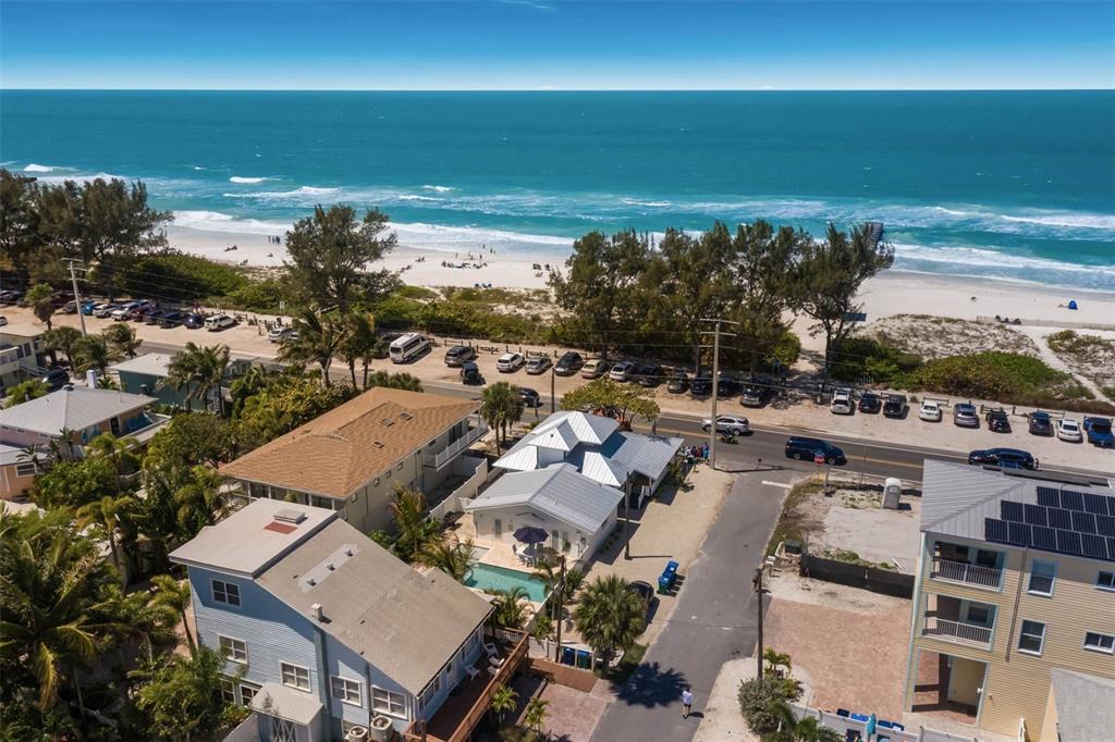 Unbelievable views!! This gorgeous newly renovated property with a brand new private pool. does not disappoint. With the beach directly across the street and Bridge St only a 5 minute stroll away, this 4 bedroom, 4 bath home is the perfect combination of location and island charm. Home is professionally decorated inside and out with beautiful attention to detail. Enjoy a large wrap around front porch that you can hear the waves from and the top balcony with amazing views of the sunset. The large great room and spectacular views make this home the perfect place to entertain or relax with friends and family. This home is turnkey and would make the perfect beach retreat or investment property with its great potential for rental income.