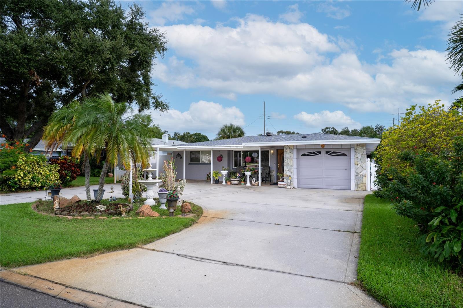 Welcome to this beautifully updated home in the heart of Seminole, perfectly positioned just steps from Blossom Lake Park and the Seminole Trail. Enjoy direct access to walking paths, playgrounds, picnic areas, and serene lake views—right in your backyard community.
This home offers peace of mind with a brand-new roof with solar panels, a 2024 AC system, and newer windows for energy efficiency. Inside, you’ll love the open and inviting spaces featuring a fully upgraded kitchen with quartz countertops, stainless steel appliances, and modern cabinetry. Both bathrooms have been tastefully renovated with stylish finishes for a fresh, contemporary feel.
The backyard is a private oasis with lush landscaping, a tranquil koi pond, and two storage sheds, offering both relaxation and practicality. With its fantastic curb appeal and move-in ready updates throughout, this property is the perfect blend of comfort, convenience, and charm.
