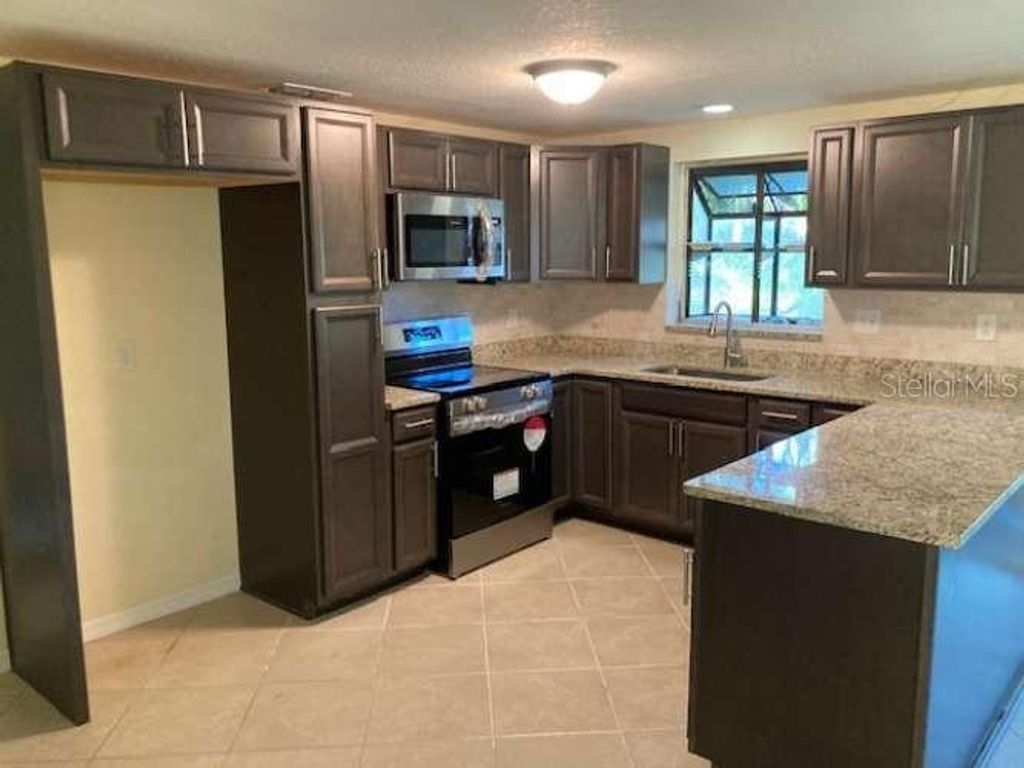 Photo of 17220 Estes Road, Lutz, FL 33548 (MLS # TB8388079)