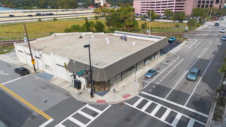 Prime Opportunity in the Heart of Downtown Orlando!  Take advantage of this rare chance to own an iconic building in downtown Orlando, boasting unbeatable exposure right on Orange Avenue and visibility from I-4! This highly sought-after property provides endless possibilities for investors and business owners alike.  Currently divided into two functional spaces, one side features a spacious, multi-office layout ideal for corporate headquarters or creative workspaces, while the other side is occupied by a Benjamin Moore paint store with a lease in place for just over two years. This section offers ample retail and warehouse space, complete with a loft—perfect for inventory or additional workspace. Whether you’re looking to utilize the building as-is, establish a flagship business, or explore redevelopment opportunities, this property offers a unique opportunity to create a lasting impact in the heart of the city. Embrace the potential to go vertical and expand within one of Orlando’s premier locations!
