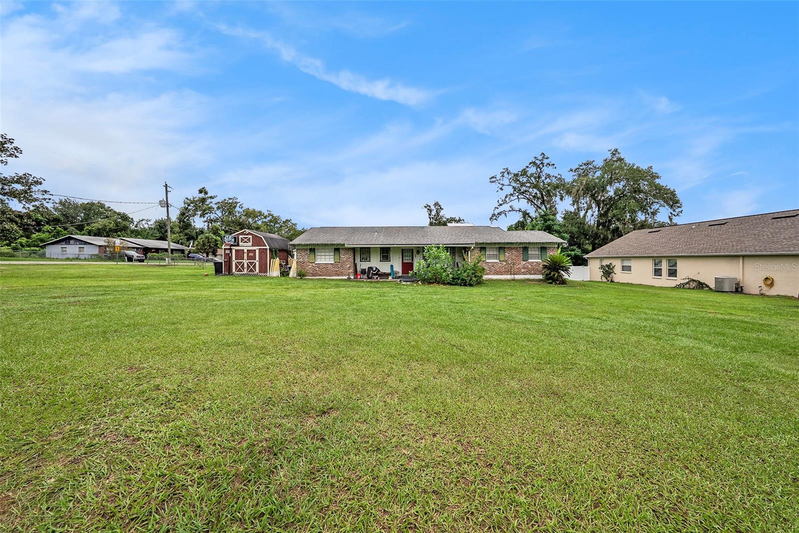 Renovation Opportunity on Nearly an Acre – Corner Lot!
This spacious corner-lot property sits on almost an acre and is full of potential. The home needs renovation and has no flooring—perfect for customizing to your style. Features include an updated kitchen, a newer HVAC system (just a couple of years old), and a large shed with electrical hookup—ideal for a workshop or studio. A great opportunity to create your dream space!