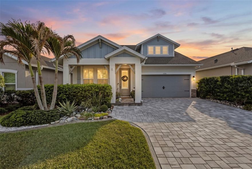 A thoughtfully upgraded home where nearly every space has been elevated with custom detail. From the moment you walk in, you’ll notice the consistency in finishes, including luxury vinyl plank flooring throughout the main areas, crown molding, plantation shutters, shiplap accents, and upgraded sliding glass doors.

The curb appeal sets the tone with a paver driveway and walkway framed by lush, tropical landscaping, all meticulously maintained. The front of the home overlooks a peaceful pond and preserve. 

Inside, an open flex space sits just off the entry and works well as a home office, with a half bathroom nearby. The layout then opens into a spacious kitchen, dining, and living area.

The kitchen features stone countertops, a farmhouse sink, stainless steel appliances, and a gas stove, all flowing directly into the main living space. Custom woodwork continues throughout, adding to the finished feel of the home.

Off the living room, upgraded sliding glass doors open to the backyard, where extended pavers and a pergola-style covered area create a true outdoor retreat. Mature tropical landscaping surrounds the space, giving it privacy and a well-established feel.

The primary suite is located on the first floor and includes a shiplap accent wall, along with an en suite bathroom featuring double sinks, a walk-in shower, additional built-in cabinetry, and a custom walk-in closet.

Upstairs, you’ll find two additional bedrooms, two full bathrooms, and a large bonus room that can easily be converted into a fourth bedroom or used as a second living area.

The home also includes a laundry room with built-in cabinetry for added storage. The 3 car tandem garage features an upgraded stainless steel utility sink, attic stairs, extra storage and a new commercial water softener. 

Located in the highly desirable Asturia community in Odessa, residents enjoy resort-style amenities including a clubhouse, fitness center, resort pool, playground, dog park, and scenic walking trails. With convenient access to the Suncoast Parkway, SR 54 shopping and dining, and top-rated schools, Asturia continues to be one of the most sought-after communities in the Tampa Bay area.