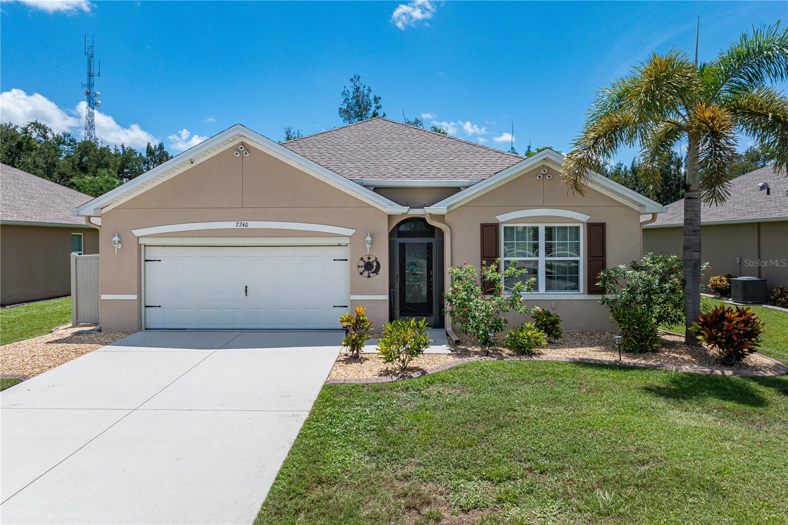 WATERFORD ESTATES GEM WITH MODERN KITCHEN & WOODED VIEW - Looking for a gated community where everyday feels like you're on vacation? Look no further...this FOUR bed/TWO bath home in Waterford Estates has it all! From a fresh modern kitchen & updated bathrooms to the extended lanai, this home truly captures Florida-style living. Waterford Estates features resort-style amenities that include two pools, a clubhouse with fitness and game rooms, plus bocce and pickleball courts. HOA fees include lawn care, irrigation, and recreation facilities for easy, low-maintenance living. Nestled on a quiet street with no rear neighbors and a wooded backdrop, the home is move-in ready. It opens with a welcoming foyer that leads into an open-concept living space. At the center is a crisp white kitchen with granite counters, undercabinet lighting, and new stainless steel appliances including a convection oven w/built-in air fryer. A textured stone backsplash adds warmth and contrast, while the large island with seating connects effortlessly to the dining area and great room. Other architectural details include high ceilings w/crown molding, neutral paint colors w/hints of coastal elegance, tile flooring throughout the main living areas, carpet in the guest bedrooms & wood-look luxury vinyl plank flooring in the master. The living space is anchored by large windows and sliders that invite in natural light and offer direct access to the screened lanai. The master suite boasts an elegant master bath w/granite counters, built-in storage, seated vanity and a frameless glass shower plus a large linen/storage closet, private WC & oversized walk-in closet w/built-ins. Three generous guest rooms share the guest bath. Out back, the oversized screened lanai stretches the full width of the home, creating an outdoor living area that’s equally suited for relaxing or entertaining. The stamped concrete floor, multitude of ceiling fans, and mounted TV elevate the space to an outdoor living room. Other amenities include an attached two-car garage w/remote-controlled screen door, whole house water softener, kitchen RO system, security cameras & Ring doorbell. Interior access to the air-conditioned utility closet was added to the garage for storage of golf clubs or other items needing a climate-controlled environment. This is Florida living at its best. Come discover what makes Waterford Estates such a desirable community. Make an appointment today.