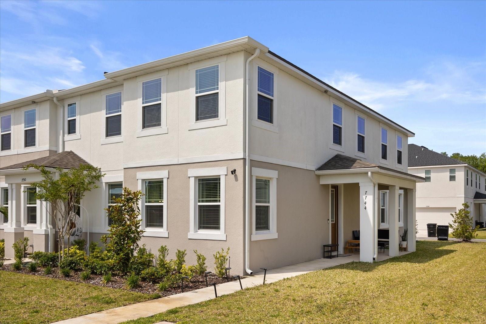 Welcome to 7744 Clove Hitch Way, a stunning 3-bedroom, 2.5-bathroom townhome in the sought-after Meridian Parks community of Orlando, FL 32832. Built in 2024 and spanning approximately 1,659 square feet, this modern corner unit offers contemporary elegance with clean lines, high-end finishes, and an open-concept layout.
Step inside to a bright, airy interior featuring sleek quartz countertops, stainless steel appliances, and stylish black accents in the gourmet kitchen—ideal for entertaining or daily living. The spacious living and dining areas flow seamlessly, enhanced by abundant natural light, chic ceiling fans, and luxury vinyl plank flooring throughout the main level. Upstairs, discover a versatile loft space, three generous bedrooms including a luxurious owner's suite with an ensuite bath and walk-in closet, plus additional well-appointed bathrooms with modern fixtures and tiled surrounds.
As a corner unit, enjoy extra privacy and a larger outdoor space with a private patio perfect for relaxation, plus a rear-loading 2-car garage for added convenience. The vibrant Meridian Parks community elevates your lifestyle with a resort-style amenity center featuring a one of a kind pool with a splash park for the kiddos, state-of-the-art fitness center, yoga lawn, amphitheater for events, playground, dog park (Paw Park), event lawn with firepit, outdoor art installations, multiple parks and green spaces, walking trails, and a bike share program. Located in vibrant Orlando, you’re minutes from Lake Nona’s shopping, dining, and top-rated schools, with the added bonus of proximity to Innovation High School—ideal for families. Don’t miss out on this exceptional property in Orlando’s booming market—opportunities like this won’t last long, so schedule your private showing today!