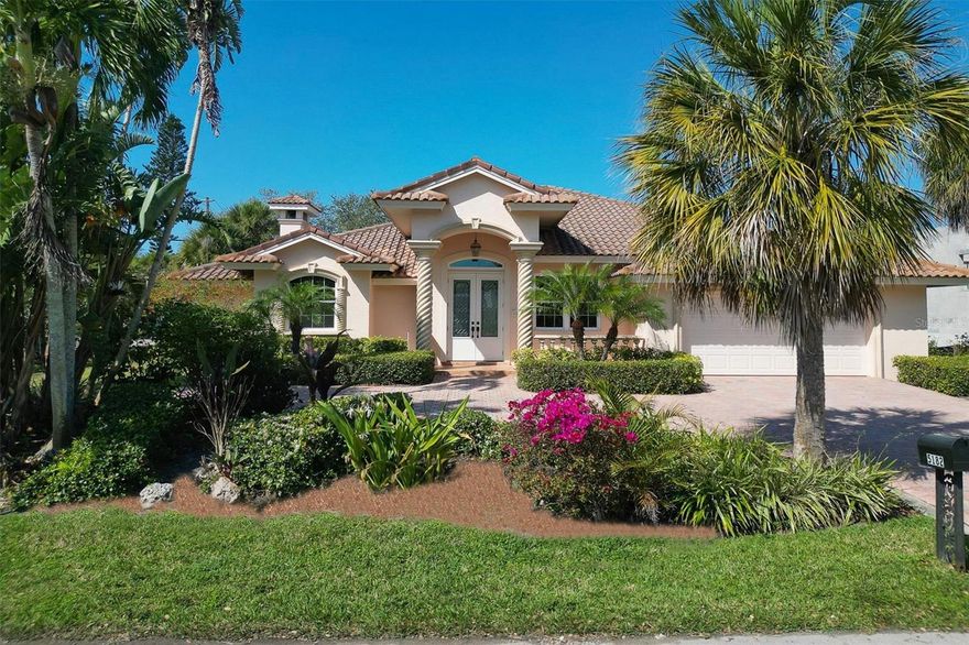 Under contract-accepting backup offers. Savor Siesta Key living just moments from the award-winning white sands of the beach in this 3BR + office/4.5BA waterfront home. Perfectly positioned on a sprawling, beautifully landscaped corner lot with 116’ of water frontage, this vacant and move-in-ready residence captures tranquil views of the convergence of 2 boatable waterways! Upon entry, the openness and spaciousness, of the combined of high ceilings and ceramic tile and oak wood floors in the main living areas create a roomy ambiance fit for comfortable family living and entertaining groups of any size. The wood and granite kitchen with breakfast room is both large and well-equipped, with a recently upgraded refrigerator and dishwasher, tile backsplash, center island and an adjacent eat-in area. Outside areas are truly stunning and expansive, starting with the oversized screened lanai with pool & spa with plenty of seating space and a pool bath.  Begin your nautical adventures with ease from the boat dock with 10,000 lb. lift or simply enjoy the additional jet ski and kayak storage provided by the upland cut. Additional outstanding features include NEW HURRICANE IMPACT WINDOWS AND SLIDERS, new water heater, 2 new HVAC units, 2-car garage with an extra fridge and subterranean termite control in place.  Located just North of Siesta Village, minutes from world-famous Siesta Key Beach, shopping, dining, & nightlife, 5-miles to downtown Sarasota for theater, arts and entertainment.