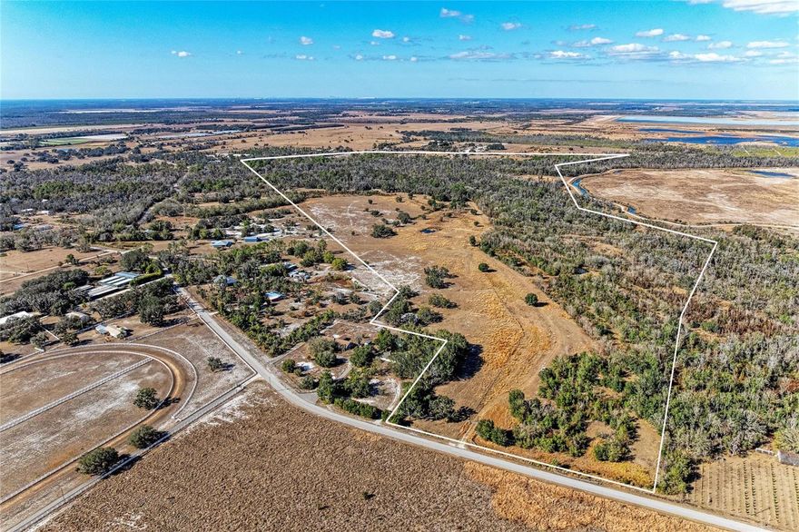 Exploring the potential of this one-of-a-kind property. Nestled on Taylor Grade Road in the heart of northern Manatee County, this 150+/- acre ranch offers a rare blend of productive pasture, pristine oak hammocks, and untouched native Florida habitats. Roughly two thirds of the land is upland, providing ample space for improved pasture and well maintained cattle pens, while the remaining one third comprises valuable wetlands, cradled by the South Fork of the Little Manatee River that traces the property’s eastern edge. An interior network of dirt roads and comprehensive fencing—including cross fencing—ensures smooth animal movement and easy access to every corner of the property. Strategically positioned, the ranch delivers a lifestyle of both seclusion and convenience. A short 15 minute drive brings you to the quaint community of Parrish, while major growth corridors are within comfortable reach: Fishhawk Ranch in just over half an hour, Lakewood Ranch and Bradenton in 40 minutes each, and the vibrant cultural hubs of St.?Petersburg, Tampa, and Sarasota in under an hour. This central location also guarantees quick trips to shopping centers, reputable schools, and major highways, making daily commutes and weekend getaways effortless. Whether you’re an experienced cattle producer seeking expansive, well organized grazing land, an eco enthusiast drawn to Florida’s distinctive wetlands, or an investor eyeing a versatile parcel that balances agriculture with development potential, this property stands out as a uniquely adaptable canvas—ready to accommodate the vision you bring to its rolling fields and river kissed borders.
