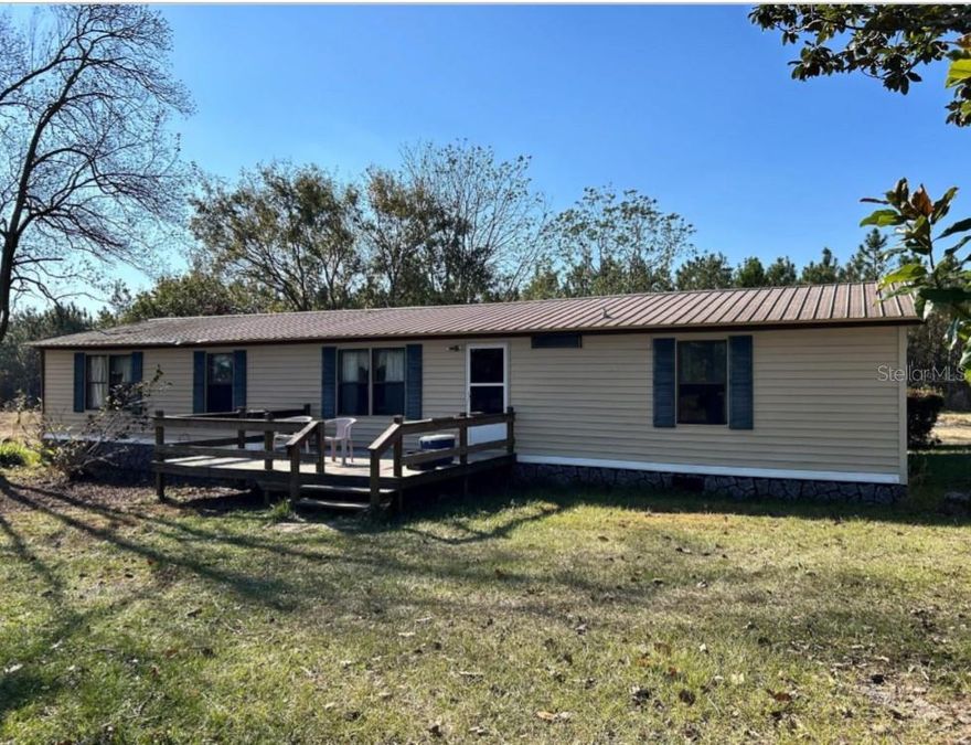 This manufactured home sits on 10 acres of cleared land and is currently home to several horses. Equestrian features include a 5-stall barn, water to the pastures, and a separate shelter located in a second pasture—ideal for rotating or separating horses. Area is very tranquil and out of the hustle and bustle of city life.
The home offers a large living area, a spacious kitchen, and a separate dining area. The split bedroom floor plan provides privacy, along with ample storage throughout. Enjoy outdoor living on the large covered back patio. Additional improvements include a shed housing the well and another covered structure for extra storage.
Major updates include a metal roof installed in 2014 and a new A/C system with new ductwork in 2021.  It is easy to show with little notice but try to give some.