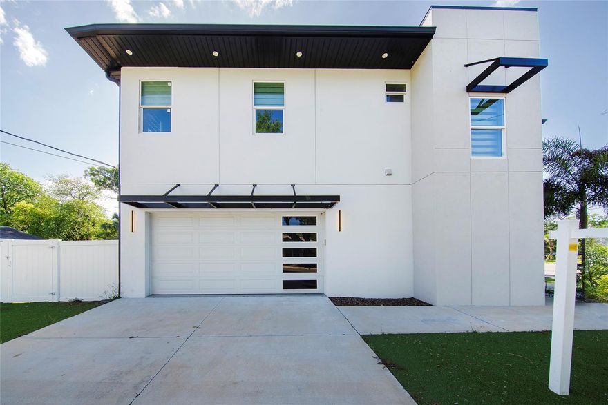 One or more photo(s) has been virtually staged. PRICED TO SELL and packed with over $60,000 in UPGRADES, this jaw-dropping modern home is the one you’ve been waiting for! Built in 2023 and sitting proudly on a premium CORNER lot, this home is in absolutely flawless, MOVE-IN READY condition and delivers the perfect blend of style, comfort, and convenience.

From the moment you arrive, you’ll be impressed by the SLEEK contemporary architecture, low-maintenance ARTIFICIAL grass, and clean curb appeal. Step inside to a STUNNING open floorplan featuring soaring TRAY ceilings, porcelain tile and wood laminate flooring, and eye-catching modern lighting fixtures throughout.

The heart of the home is a SHOWSTOPPER, an oversized QUARTZ island anchors the designer kitchen, complete with high-end appliances, modern finishes, and stylish window treatments. This space flows EFFORTLESSLY into the living and dining areas, making it perfect for entertaining or everyday living.

With 4 spacious bedrooms, 2.5 beautifully designed bathrooms, and a 2-car garage, there’s room for everyone to live comfortably. Step outside to your PRIVATE oasis featuring a fully PVC-fenced backyard with a PAVERED patio, ideal for hosting, relaxing, or enjoying Florida living year-round.

Enjoy peace of mind with hurricane impact windows and the benefits of NEWER construction without the wait. Well-INSULATED home ensures your sanctuary stays peaceful and quiet.

NO HOA OR CDD FEES TO WORRY ABOUT!

Location is EVERYTHING, and this home delivers! Just minutes from Lowry Park Zoo, Downtown Tampa, Tampa International Airport, International Plaza, Westshore District, Raymond James Stadium, and easy access to Interstate 275. Plus, you’re only 30 minutes from some of Florida’s most beautiful beaches.

Homes like this don’t come around often. Schedule your SHOWING today before it’s gone!