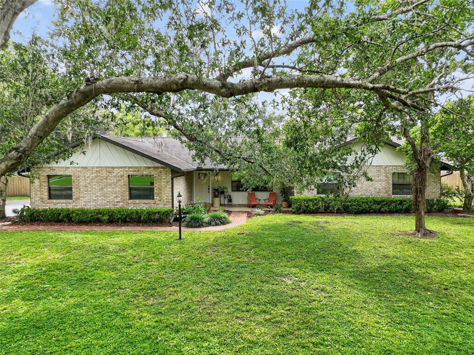 Welcome to 2412 Briarwood Lane, a beautifully maintained 3-bedroom, 2-bath pool home tucked away on a spacious half-acre lot in the desirable Briarwood neighborhood of Eustis with no HOA. Built in 1986 and updated in 2023/2024 this residence offers 1838 square feet of living space, combining timeless appeal with a functional layout designed for comfortable everyday living. From the moment you arrive, you’ll be charmed by the curb appeal, mature landscaping, and the quiet, tree-lined setting that provides a sense of peace and privacy.
Inside, the home features an open concept floor plan, vaulted ceilings, wood look- low maintenance luxury vinyl flooring, light-filled living and dining spaces that flow seamlessly, creating a welcoming environment for both relaxing and entertaining. The kitchen offers ample cabinetry, generous counter space, quartz countertops with tile backsplash, built in oven, cooktop, drawer microwave and views of the backyard & pool, while the cozy adjoining family room has electric fireplace with shiplap accents and sliding doors leading to the screened porch.
The private owner’s suite includes a spacious bedroom, 2 closets, and updated ensuite bath with walk in shower, dual vanities & laundry area with floating wood shelves and folding table. Split bedroom plan offers privacy for your family or guests – the two additional bedrooms are well-appointed, and the guest bathroom has large vanity, and shower with tub.
Outdoors, the large, screened porch is a perfect year-round retreat overlooking the pool and fenced backyard. The oversized ½ acre +/- lot is a true highlight, offering endless possibilities for enjoying the Florida lifestyle.
Other features include utility shed, well for irrigation, new drainfield 2024, HVAC 2022, premium brand appliances 2024, water softener, hot water heater 2024, roof 2013 & exterior paint 2025.
A two-car garage and extended driveway offers plenty of room for parking for your toys and/or guests.
Ideally located just minutes from shopping, dining, schools, and the chain of lakes that make Eustis and Mount Dora so sought after, this home offers the perfect blend of tranquility and convenience.