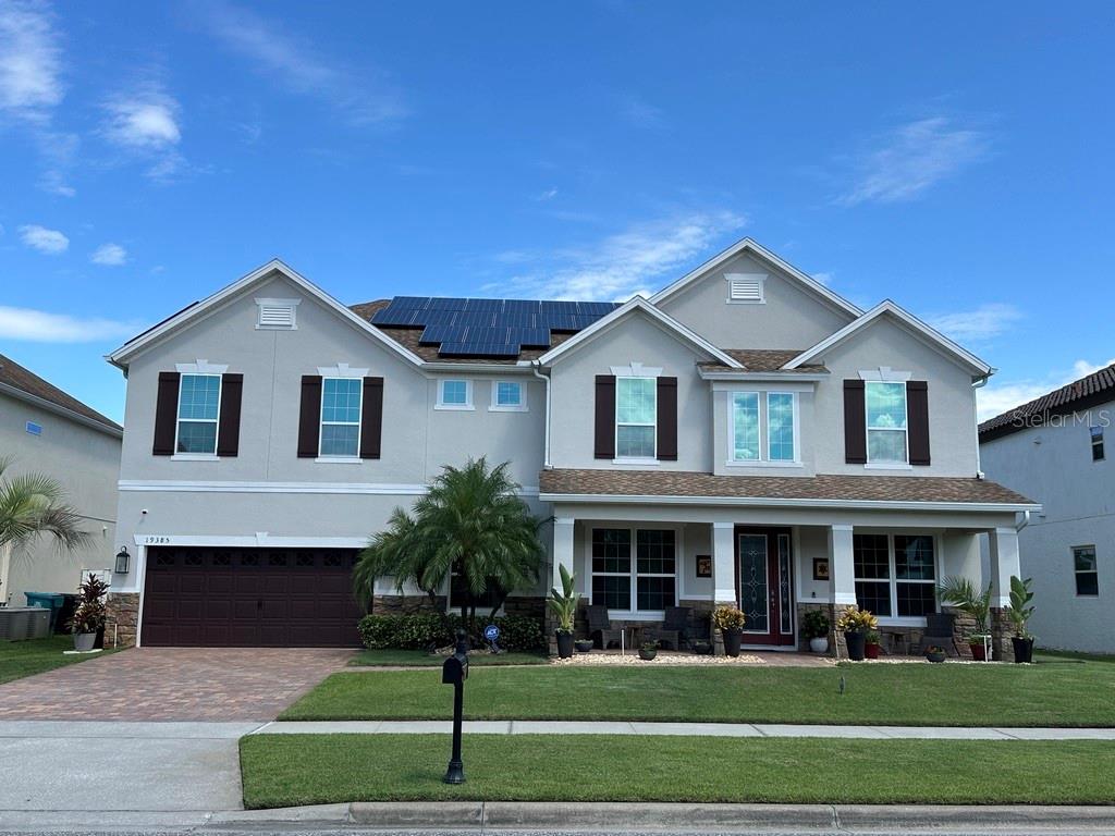Welcome to 19385 Pummelo Dr, a stunning 5-bedroom, 4-bathroom home located in the heart of Orlando, Lake Nona FL. This luxurious property offers the perfect blend of elegance, comfort, and modern convenience, making it an ideal oasis for families looking for their dream home. As you approach the home, you are greeted by a beautifully landscaped front yard and a grand entrance that sets the tone for what lies inside. Step through the front door and be welcomed by a spacious and inviting living area, featuring high ceilings, large windows that flood the space with natural light, and elegant finishes throughout. The gourmet kitchen is a chef's dream, boasting top-of-the-line stainless steel appliances, custom cabinetry, granite countertops, a center island with a breakfast bar, and a walk-in pantry. The kitchen seamlessly flows into the dining area, creating the perfect space for entertaining guests or enjoying household meals. The master suite is a true retreat, offering a tranquil space to unwind after a long day. The en-suite bathroom is a spa-like oasis, featuring a soaking tub, separate shower, dual vanities, and a large walk-in closet. The remaining bedrooms are spacious and bright, offering plenty of room for house members or guests. Solar Panels leased and are transferable via finance.