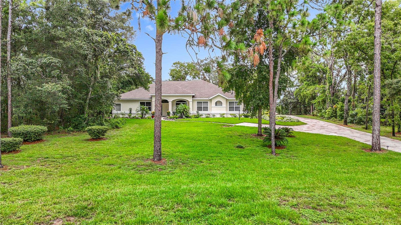 Fall in love with this picturesque Golf Course View heated pool home that is located within walking distance to the Citrus Hills Country Club. Social Membership grants you access to premier amenities and an active community lifestyle, such as Premier Golf Courses, 4 fitness centers, tennis courts, luxury pools, pickleball courts, fine dining, community center, social clubs and so much more. This expansive single-story home welcomes you with an open and airy floor plan, featuring 4 bedrooms, 3 baths and a 3-car garage. As you approach you will immediately fall in love with the gorgeous, landscaped front yard with majestic oaks, botanical garden style flower beds, an expansive driveway leading to a side garage, offering ample storage and parking. The open floor plan features a formal living room, dining room and a spacious family room. The size and layout of this home is ideal for hosting family gatherings. The primary suite is a true retreat, boasting an ensuite bathroom complete with a jacuzzi tub, a separate walk-in shower, and dual sinks and new flooring—offering both comfort and elegance. The bedroom itself is spacious and includes a large walk-in closet. The home features a well-appointed second and third bedroom, thoughtfully connected by a beautifully designed Jack and Jill bathroom. The 4th bedroom is set up as an office with a built-in desk/workspace. This arrangement offers privacy and convenience, making it perfect for family members or guests. At the heart of the home is a chef-inspired eat-in kitchen, recently updated to delight even the most discerning cooks. Gleaming granite countertops provide an abundant workspace, while freshly painted cabinets add a touch of modern style. The kitchen is equipped with stainless steel appliances, a gas cooktop, built-in oven and microwave, and a walk-in pantry, promising effortless meal preparation and plenty of space for entertaining. Step outside to discover your private paradise, beginning with a sparkling heated lap pool, perfect for morning exercise or lazy afternoons under the sun. The full acre is beautifully landscaped and offers an additional parking pad. The formal dining room and separate formal living room creates a perfect place to host family gatherings.
One of the most desirable features of this residence is its unbeatable location. Imagine living just a short stroll from the exclusive country club—making it easy to enjoy world-class golf, tennis, dining, and social events without ever getting in your car. Whether you’re an avid golfer, a fitness enthusiast, or just love the country club lifestyle, this community has something for everyone. Walking and biking trails, beautifully maintained grounds, and a friendly neighborhood atmosphere make it a joy to call this place home. Additional features include Roof 2016, Trane AC, new water heater, newer recess lighting, and some new flooring. Citrus County is known for its crystal-clear springs and rivers. It is conveniently located close to the famous Crystal River, home of the world-renowned Manatee Migration and scallop season. The Rainbow River, Three Sister Springs and the Homosassa River are all well known for swimming, kayaking, boating and some of the best fishing in Florida. Conveniently located near new retail shops, restaurants, and grocery stores. Close to the Suncoast parkway for quick access to the airport, Tampa, Clearwater and St. Pete Beaches.