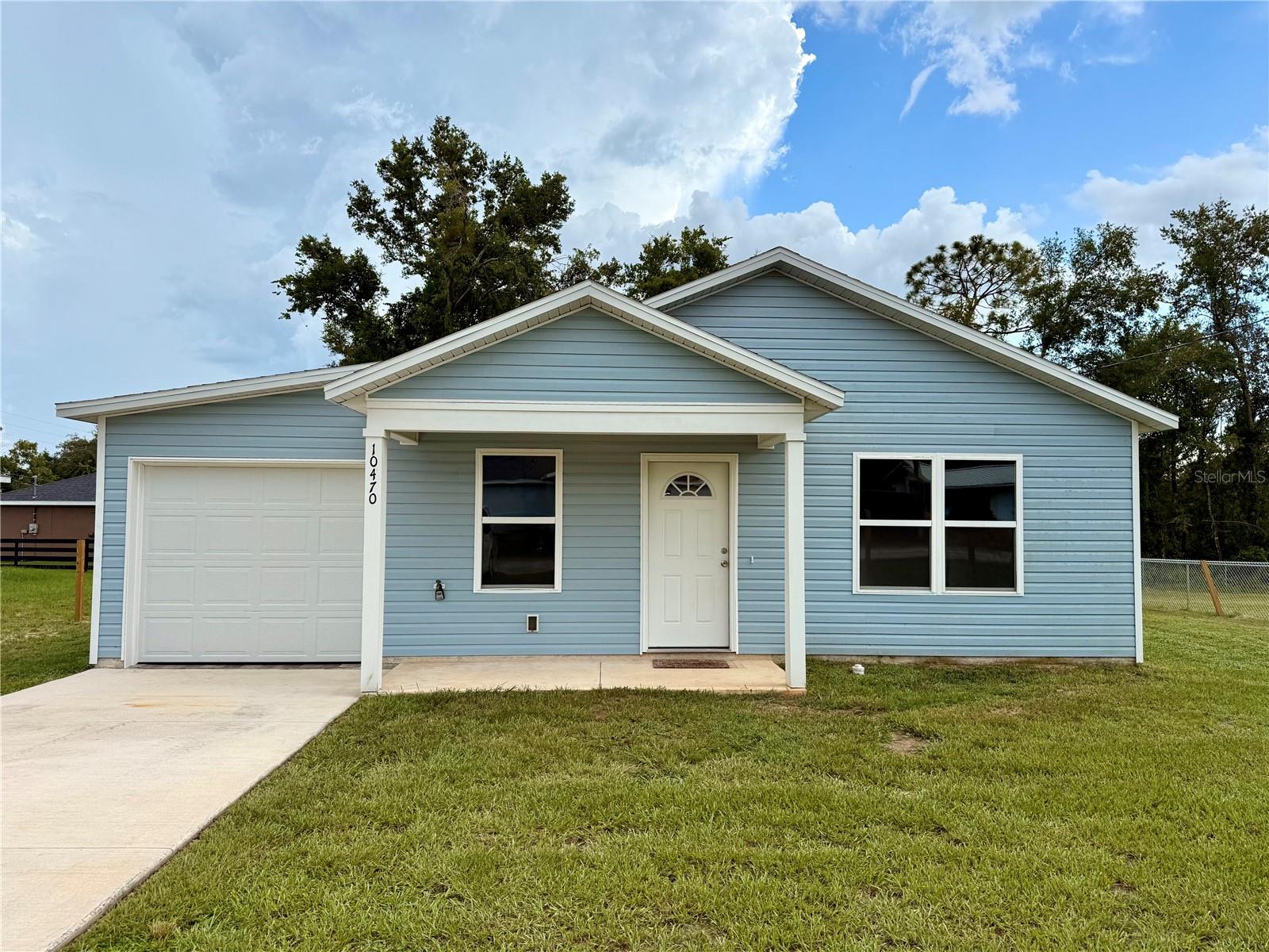 Brand-New Cottage Home for Rent Near Lake Weir! ** Rent Includes Lawn Care & Backyard will be fenced by home owner
Be the very first to live in this beautiful newly built cottage home, ideally located in the desirable Lake Weir Heights neighborhood—just minutes from scenic Lake Weir. With modern finishes, spacious design, and charming details, this home offers both comfort and style.
Property Highlights:
Spacious Layout: Generously sized rooms provide plenty of space for relaxing, entertaining, and everyday living.
Modern Kitchen: The open kitchen flows seamlessly into the living area, perfect for gatherings. Features include granite countertops, stainless steel appliances, and a large island for cooking or casual dining.
Durable & Stylish Flooring: Luxury vinyl plank flooring throughout offers both beauty and easy maintenance.
Inviting Front Porch: A country-style porch is the perfect spot to enjoy your morning coffee or unwind in the evenings.
Charming Roof Design: The 6' 12" pitch roof adds unique character and curb appeal.
Bedrooms & Baths: Three bedrooms and two full bathrooms provide comfortable accommodations for residents and guests.
Garage & Storage: Attached 1-car garage for parking and additional storage.
Additional Details:
Brand new construction—never lived in!
Land is fully cleared and landscaped, providing a fresh and welcoming setting.
Conveniently located near Lake Weir, offering outdoor recreation, dining, and small-town charm.
This pristine home is ready for its first tenant and will not last long. Don’t miss the chance to call this stylish new cottage your home!