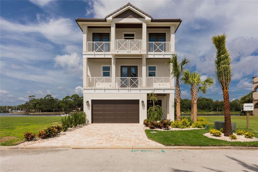 DIRECT INTRACOASTAL HOME – NEWLY COMPLETED BUILD -2024.  Yacht Harbor Village Marina, an exclusive gated luxury community boarders the Intracoastal Waterway in Palm Coast. Here, excellence means one-of-a-kind homes with luxury design, custom builds, and a serene, family-friendly setting.  This stunning modern Coastal home has been beautifully appointed with exquisite upgrades throughout with attention to the highest detail where quality materials are evident. .   Embrace the coastal lifestyle, where panoramic water views become your daily backdrop. Amazing ICW vistas from most rooms on every floor with exterior features including fish scale shingles, aluminum louvre details, front and rear balconies with tongue and groove exterior ceilings all enhance the coastal theme! An elevator servicing all three floors, Casual Coastal elegance is the interior theme.  First floor features 4 car garage with expoxy floors, gathering room with access to stunning saltwater pool, spa, summer kitchen and patio overlooking the ICW, full bathroom and storage galore. The luxurious second-floor main living has an open-concept plan with expansive windows and abundant views of the Intracoastal Waterway.  Main living area including great room  featuring built-ins with 84" TV, gourmet kitchen with Café series appliances including 42” gas range and refrigerator and dining area as well as the east facing primary suite. Third floor features 2nd owner’s suite overlooking ICW, two guest suites and den.  From the natural wood floors and quartzite counters to the high ceilings with tongue and groove accents, every inch of your home brings comfort and high-quality design. With four bedrooms, three stories, and 4,508 square feet of space, your home brings the luxury lifestyle and the feel of being on vacation every day!   Yacht Harbor is a beautiful gated, maintenance free community offering all exterior lawn & tree care. Amenities are offered through Hammock Beach Club memberships which include access to on-site Hydro-Grid clay tennis and pickle ball courts, state of the art fitness center and luxurious pool area.  The Club membership extends to also include 2 championship golf courses/clubhouses, dining, a fantasy pool complex with 6 pools and lazy river, waterslides, beach access, fitness center, spa and much more – making this an opportunity that extends beyond the walls of your home!   Home plans available for viewing.