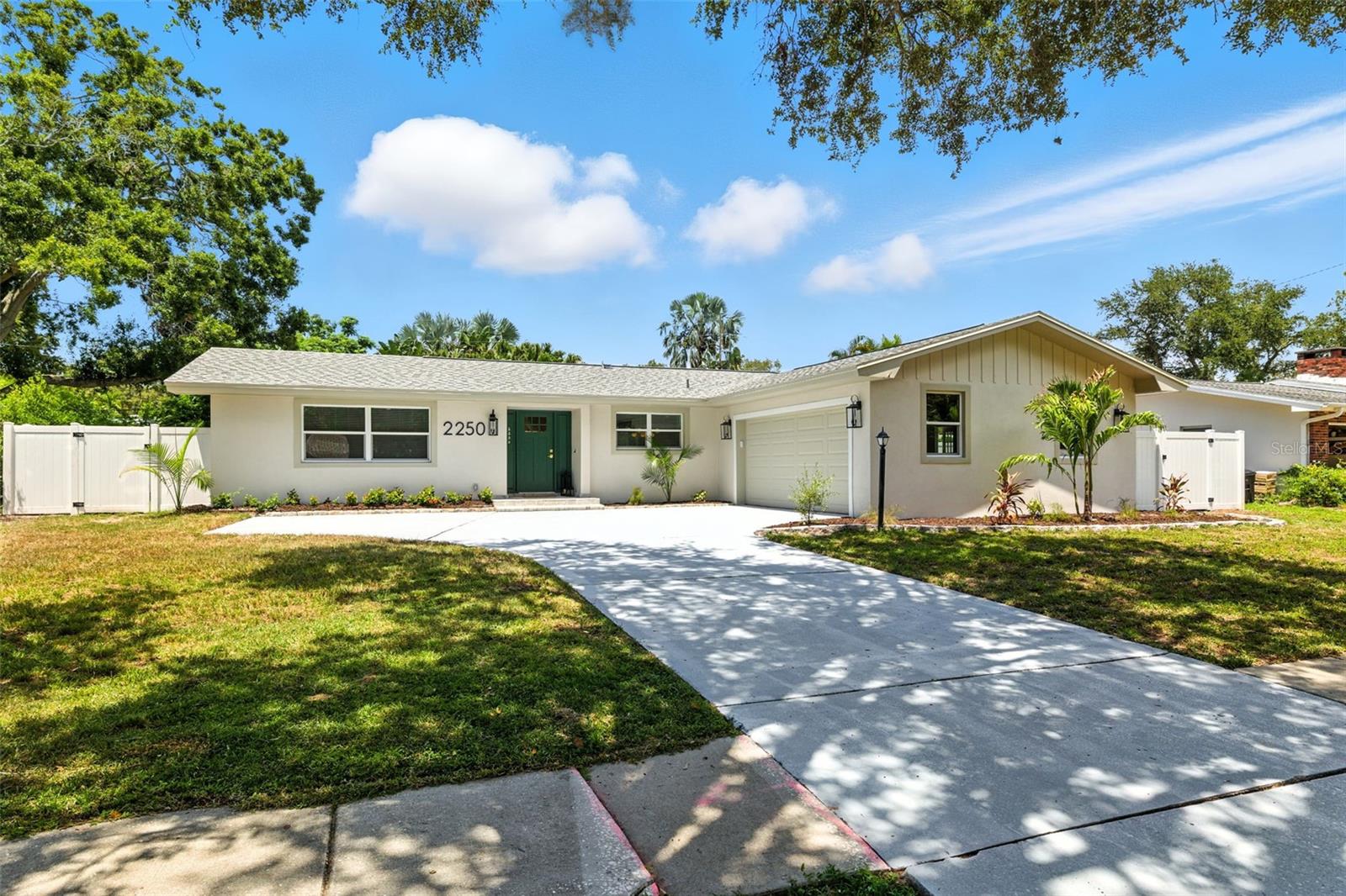NO FLOOD INSURANCE is required, NON-EVACUATION ZONE, and NO DEED RESTRICTION. A prime location and undeniable potential. This impeccably renovated POOL HOME is the perfect 4-bedroom, 2 bathroom, and oversized 2-car garage that has room for both cars and extra room for the hobbyist, all designed with a thoughtful split bedroom plan that ensures privacy and ease of living. The amazing pool and beautiful backyard has plenty of space to relax, garden, or entertain for the perfect blend of comfort, style, and convenience. As you step inside kitchen will the brand-new kitchen is a showstopper, featuring elegant quartz countertops and custom contemporary cabinetry, a huge island and all-new stainless-steel appliances. The well-appointed kitchen boasts amazing ALL-WOOD & SHAKER-STYLE cabinets. This house comes with New Luxury Vinyl Flooring throughout, recess lighting with dimmers, an electric fireplace, open floor plan with plenty of room in the family room area. Additional countertop for convenience, a wine refrigerator, and a pantry room with cabinets and a countertop in the open space of the Sunroom. A fresh paint job on the outside and inside, as well as modern lighting and plumbing fixtures throughout. The Master Bedroom includes a private bathroom with a step-in shower, a serene retreat with its en-suite bathroom, while the additional bedrooms offer plenty of space for family, guests, or a home office. The adjacent Florida sunroom, with new hurricane-proof sliding double-panel doors and windows that fill the home with natural light, is perfect for enjoying the sunshine year-round. A cozy family room with an electric fireplace offers the ultimate flex space, a spacious living room/dining room combo flows into the kitchen through two entrances, opening to a generous Florida room. The spacious living areas flow seamlessly, creating an inviting atmosphere for both relaxation and entertainment. The brick paved backyard area and landscape POOL designed for an outdoor private backyard oasis and enjoy privacy and security with a white vinyl fence, ideal for relaxing or hosting summer barbecues to entertaining family and friends. The side yard could be a dog run, and there is room to place a fire pit or hot tub. Not only does this home offer comfortable living, but the community is also known for its safety, friendly neighbors. Additional highlights include Brand-New roof 2025, all-new windows are double-panel hurricane windows 2025, a new water heater and electrical panel 2025, and an HVAC system replaced in 2022, which provides all the maintenance the home needs, and peace of mind for a very long time. Residents of Morningside Estates are treated to first-class amenities, including a well-equipped local fitness center with a weight room, 2 pools, an Olympic swimming pool, a play pool, tennis, basketball, and pickleball courts, along with playground. With the new $5.7 million Morningside Recreation Complex neighborhood is situated near the Duke Energy for walking and bicycling Trail. The neighborhood is a family-friendly community with fantastic neighbors and a terrific location! With roomy floor plans, pool homes and spacious backyards, the community is a wonderful area for families looking for a place to call home. Tampa International Airport, St Petersburg, Largo, Palm Harbor, Safety Harbor, and Clearwater Beach are in proximity of less than 20 min. Don’t miss this incredible opportunity.