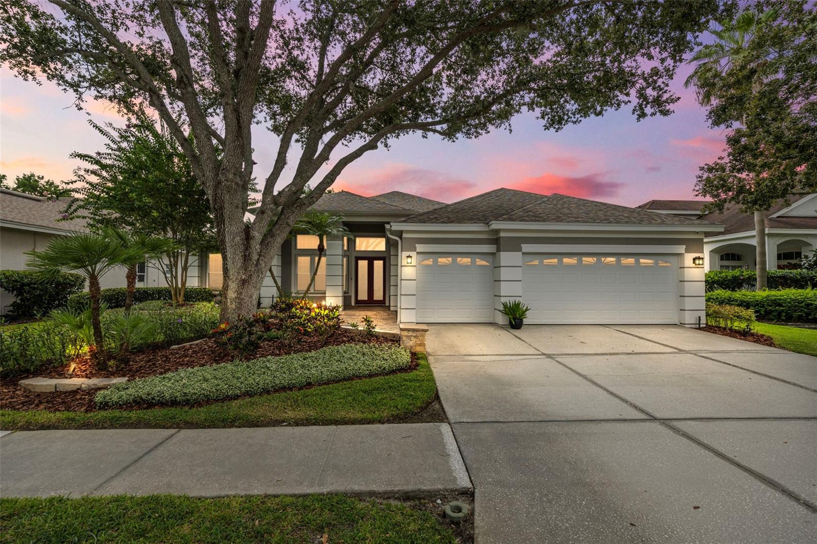 Welcome to a rare gem in the heart of Westchase — a beautifully designed 4-bedroom, 3-bath home that blends luxury, comfort, and convenience. Nestled at the end of a quiet cul-de-sac and boasting serene pond views, this 2,683 sq ft residence offers everything today’s discerning buyer could ask for. Step inside to soaring 12-foot tray ceilings and an open, split floor plan bathed in natural light. Freshly painted with premium Sherwin-Williams paint, the home feels both elegant and welcoming. The spacious primary suite is a true retreat, featuring a cozy sitting area overlooking the water, a large walk-in closet, and a spa-style bathroom with a heated floor and luxurious multiple shower heads.
Enjoy effortless entertaining in the large family room with built-in surround sound, or host formal gatherings in the separate living and dining rooms—complete with a chandelier and timeless finishes. The expansive eat-in kitchen is a chef’s delight, overlooking the pond and featuring smoked stainless steel appliances, a pantry, and plenty of counter space for prepping and gathering.
Your private outdoor oasis awaits with a screened lanai, upgraded pavers, integrated speakers, and a new pool cage installed in 2022. The solar-heated pool invites year-round enjoyment, whether you're hosting friends or enjoying a quiet evening at home.
This home is not just beautiful—it’s built for peace of mind with hurricane-impact garage doors, windows, and sliders throughout.
All of this is nestled in the heart of Westchase, known for its vibrant lifestyle and top-tier amenities including two pools, tennis and pickleball courts, two parks, and scenic walking trails. Plus, you’re just minutes from great schools, shopping, dining, airports, cruise terminals and Florida’s world-famous beaches.