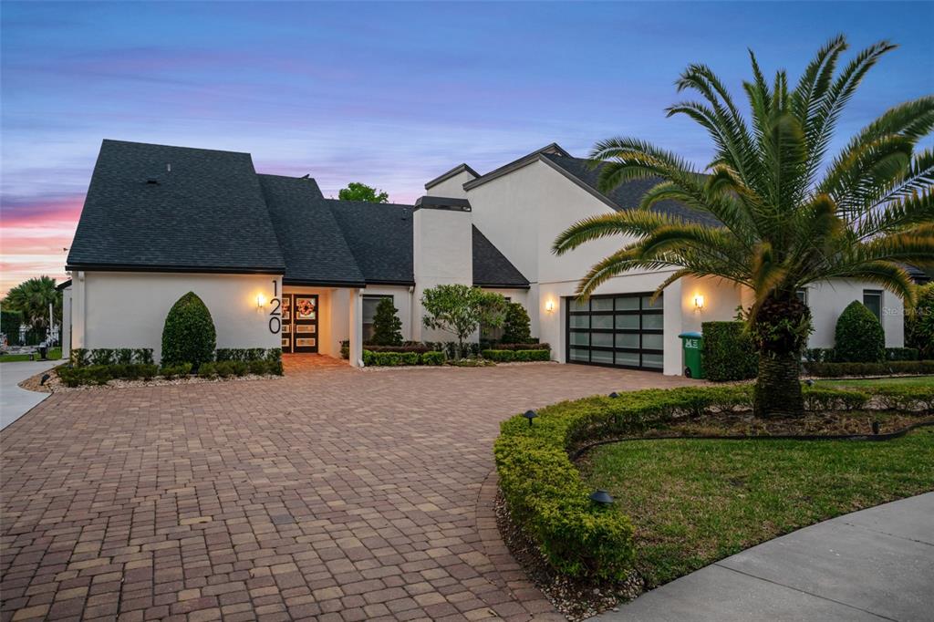 Welcome home to this beautiful contemporary lakefront home located on the Winter Park Chain of Lakes! With a plethora of recent improvements this home is sure to impress the pickiest of buyers. Some of the recent upgrades include a new roof, new sliding glass doors, completely remodeled kitchen with top-of-the-line appliances, new screen enclosure, remodeled bathrooms and so much more!! With over 4,000 square feet of living space there is plenty of room for family and guests to visit. Currently the home has 3 full bedrooms and 3 full baths, the fourth bedroom and fourth bathroom has been converted into a professional photo studio but can easily be converted back to accommodate a fourth bedroom and bathroom. As you drive up to your new home you will notice that you are on a secluded cul-de-sac in the heart of Maitland. As you enter the home it is hard to miss the beautiful views of Lake Minnehaha. The owner recently replaced the rear windows with large sliders to have complete unobstructed views of the lake. The great room features an abundance of natural light and has incredible views from every angle. The completely remodeled and updated chef’s kitchen features state of the art appliances and is outfitted with high end cabinets and marble counter tops. The formal dining room can seat the entire family and has custom paint that sparkles, same as the paint used in Frozen! Also adjacent to the kitchen is a great entertaining space, with a secondary family room with full size wet bar and brick fireplace. The master suite is a true owner’s retreat with an oversized bedroom with stunning lake views, a huge custom walk-in closet and a completely updated spa-like master bathroom with his and her vanities, large walk-in shower and free-standing tub. There are two additional oversized bedrooms that both have their own updated bathrooms. The fourth bedroom and bathroom is now a professional photo studio, it can easily be converted back. Enjoy the Florida lifestyle in the saltwater pool and spa or on the boat. The dock features a covered boat slip with lift and sundeck on top. The pool enclosure was completely redone and and pool deck has plenty of space for entertaining or spending time with family! This is one of the best locations in Maitland and you are just minutes from excellent dining, easy access to major highways and the highly acclaimed Park Avenue is just 7 minutes by car.