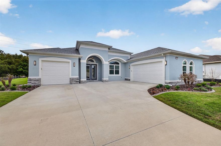 Welcome to this truly spectacular 2024 built Santa Maria model by Medallion Homes where you'll discover a perfect oasis in the highly sought-after Active Adult, 55+ community of the Lakes of Mount Dora. This beautiful home offers a unique blend of modern luxury and serene living, tailored for homeowners seeking an active lifestyle in Mount Dora, one of Central Florida's most charming cities, with easy access to Greater Orlando, and Florida's world-renowned theme parks and beaches. 
This home has 3-bedrooms, 3-baths, featuring a spectacular 3-room "in-law" suite, complete with bedroom, mini kitchen, sitting room, and a bathroom, ideal for owners who may be caring for loved ones. Combine all that with the split 3-car garage and you'll see some of why this home is so special. This spacious home features an open "Great Room" floor plan combining living room, dining room, kitchen and breakfast nook, with Crown molding, coffered 12-foot ceilings and boiserie paneling.  Impact resistant, energy saving windows and doors allow in abundant natural light, setting the mood, perfect for both entertaining and relaxation. Enjoy seamless indoor-outdoor living through the great room's 3 oversized pocket sliding glass doors, the primary suite or the in-law suite. All routes lead to the screened lanai offering a private escape with views of lush landscape and a neighbor free backyard, perfect for enjoying Florida’s year-round sunshine. Whether preparing, meals or entertaining, your chef will never be far from all the action in this well-equipped kitchen, featuring stunning white "marbled" quartz countertops and a spectacular 12-foot-long bar height island peninsula. The 42-inch soft-close cabinets and drawers and walk-in pantry ensure there are ample places for all your kitchen gadgets and food storage. Your new chef's kitchen features top-of-the-line Samsung Black stainless-steel appliances including a built-in oven, convection microwave, refrigerator and dishwasher. The impressive 5-burner gas cooktop just seals the deal in this dream kitchen. The primary bedroom offers a private sanctuary with 2 walk-in closets and a beautiful en-suite bathroom featuring dual vanities, a soaking tub, and a separate no-step walk-in shower, all beautifully designed ensuring comfort, luxury and safety. Bedroom 2 is split from the primary bedroom and is perfect for guests with the convenience of being located close to the full 2nd bath.  Or use your imagination and transform this space into your dream office, media room, or craft room.  For a low $290 monthly HOA fee, residents enjoy resort-style amenities, including a 18,000-square-foot clubhouse, the largest resort-style pool in Lake County, pickleball and tennis courts, bocce ball, croquet lawn, 4 miles of scenic trails and intra-connected waterways, community fire pit, and a gated RV/boat parking lot. Included in the HOA fee is Fiber optic internet & cable, irrigation, and access to a wide variety of clubs and activities. An added bonus is the proximity and access to the 18-hole challenging Clifton/Ezell designed golf course of the Country Club of Mount Dora, just a quick golf cart path ride away. Come see why the Lakes of Mount Dora has consistently been ranked as one of Central Florida's Premier active adult communities, and immers yourself in the charming "small" towns of Mount Dora, Tavares and Eustis, where you'll enjoy art galleries, nearly year-round festivals, great dining, boating, shopping and so much more.