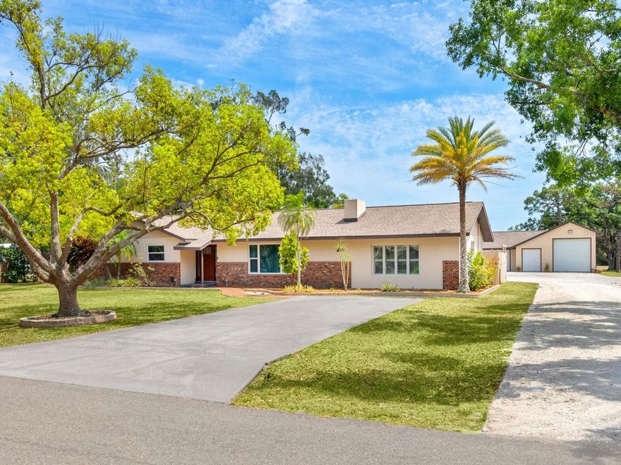 Don’t miss this rare opportunity to own an immaculately maintained home on over an ACRE of land with NO DEED RESTRICTIONS!

This versatile and beautiful property offers 3 bedrooms, 3 full bathrooms, plus a spacious BONUS ROOM—perfect as a 4th bedroom, home office, fitness studio, or additional family room.

Step outside to your private backyard oasis, where a large lanai with a custom bar overlooks a sparkling pool—ideal for entertaining or relaxing in peace. The updated kitchen and bathrooms add modern comfort and style throughout the home, while the 2-year-old roof offers peace of mind.

Car enthusiasts, hobbyists, or those with recreational toys will appreciate the massive 1,600+ sq ft detached garage with three bays, an additional lawn tractor/golf cart bay, and a dedicated office space.

Located next to Twin Lakes Park, you’ll enjoy easy access to walking trails, youth sports, and the Orioles spring training complex. Just 6 miles from Siesta Key Beach and a mile from grocery stores, restaurants, and shops, this property truly offers the best of both space and convenience.

If you're searching for a larger, private property in the heart of town, this is one you don't want to miss!