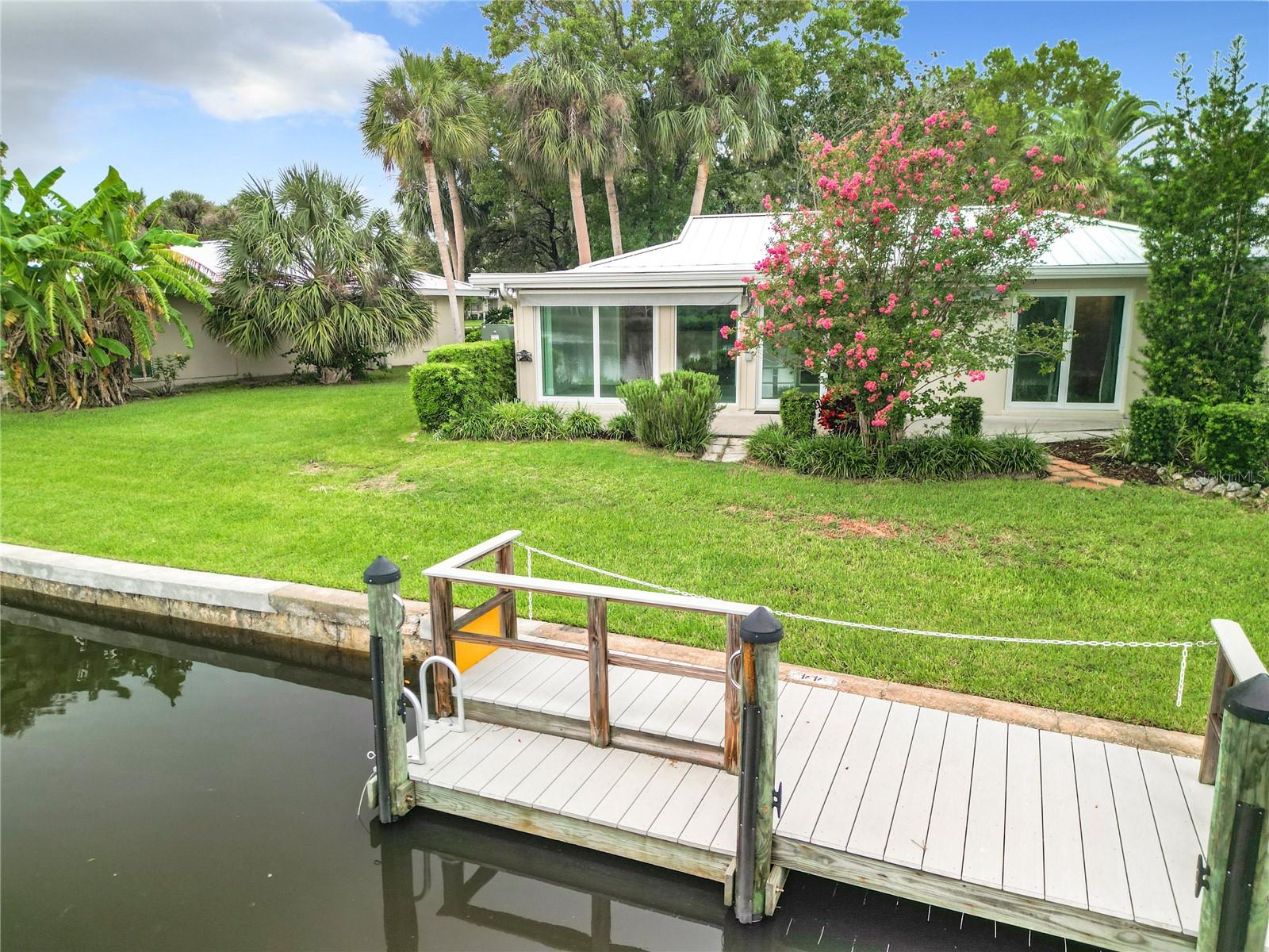MOVE-IN READY! WATERFRONT, END UNIT 2 bed/2 bath condo WITH A PRIVATE COMPOSITE DOCK and a lovely unobstructed view of open water and Florida wildlife. This unit was just totally renovated by a local GC, not the HOA’s contractor, to include granite kitchen countertops, custom Schrock wood cabinets, tile backsplash and lighting. Brand new GE Slate appliances, impact glass sliding doors, garbage disposal, kitchen sink and faucet. New (2025) AC and water heater with expansion tank. New bathroom vanities and new ceiling fans. New metal roof (2022). The rear patio has an electric remote awning with wind and rain sensor/auto retract. Lush tropical landscaping. Located in Crystal River – the Manatee Capital of the World – on Florida’s Nature Coast, this condo is set against the backdrop of King’s Bay and the Salt River with direct, no-bridge access to the Gulf of Mexico. Crystal River, waterways are known for world-class fishing, boating, and scalloping. The condo is also conveniently near historic Downtown Crystal River restaurants, bars, cafes, shops, Fort Island Beach, Aldi’s, and soon to come Margaritaville, 3 miles down the road!! Surrounded by state protected waterways and lands. Just over 1 hour from Tampa, Gainesville, and Ocala. Condo Association Fee INCLUDES FLOOD INSURANCE (64% of the fee).